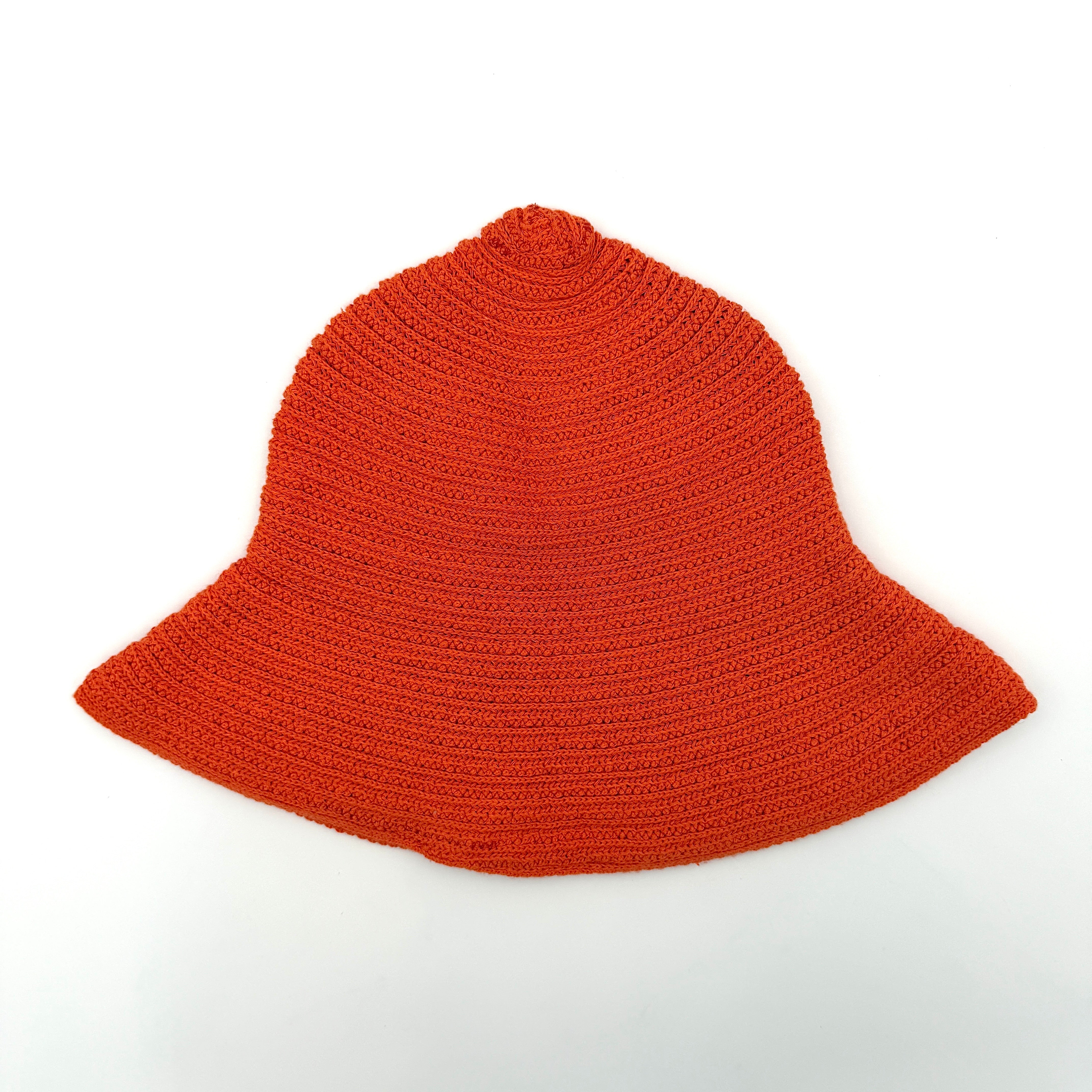 Vibrant orange Diesel crochet bucket hat with a wide brim and signature embroidered crest, displayed against a neutral background.