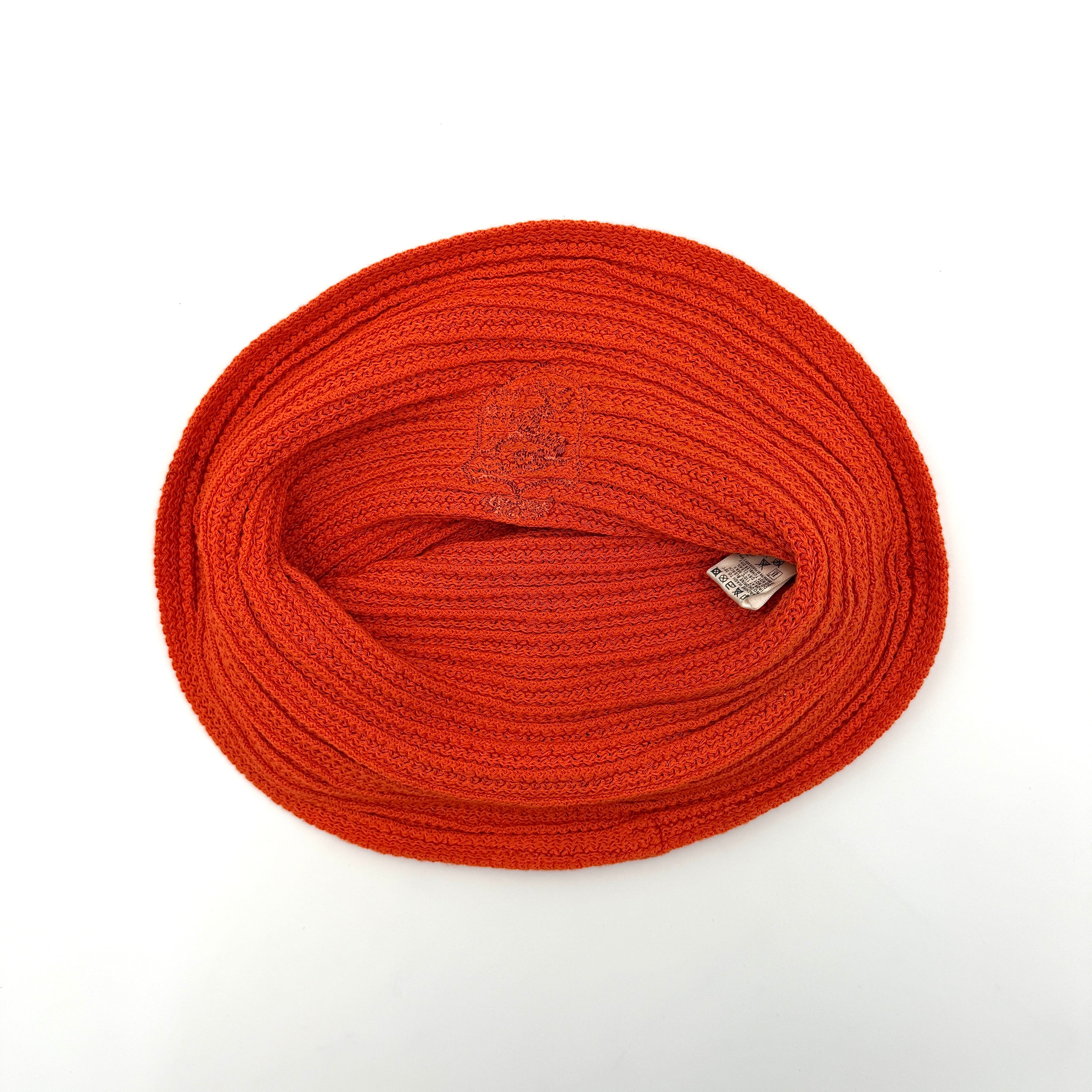 Vibrant orange Diesel crochet bucket hat with a wide brim and signature embroidered crest, displayed against a neutral background.