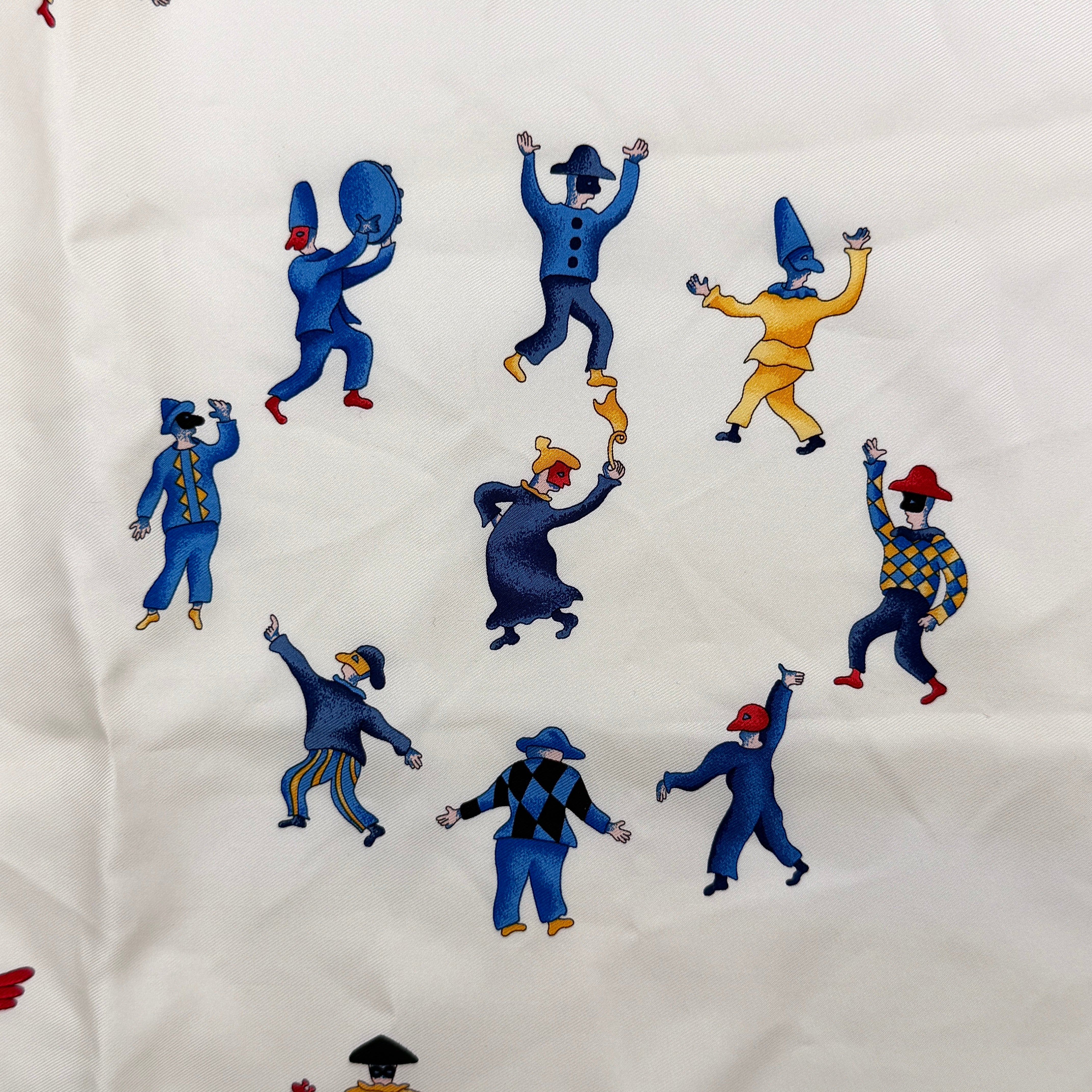 Bvlgari Girotondo di Marionette silk scarf featuring playful multicolour marionette illustrations and circus motifs on a creamy background.