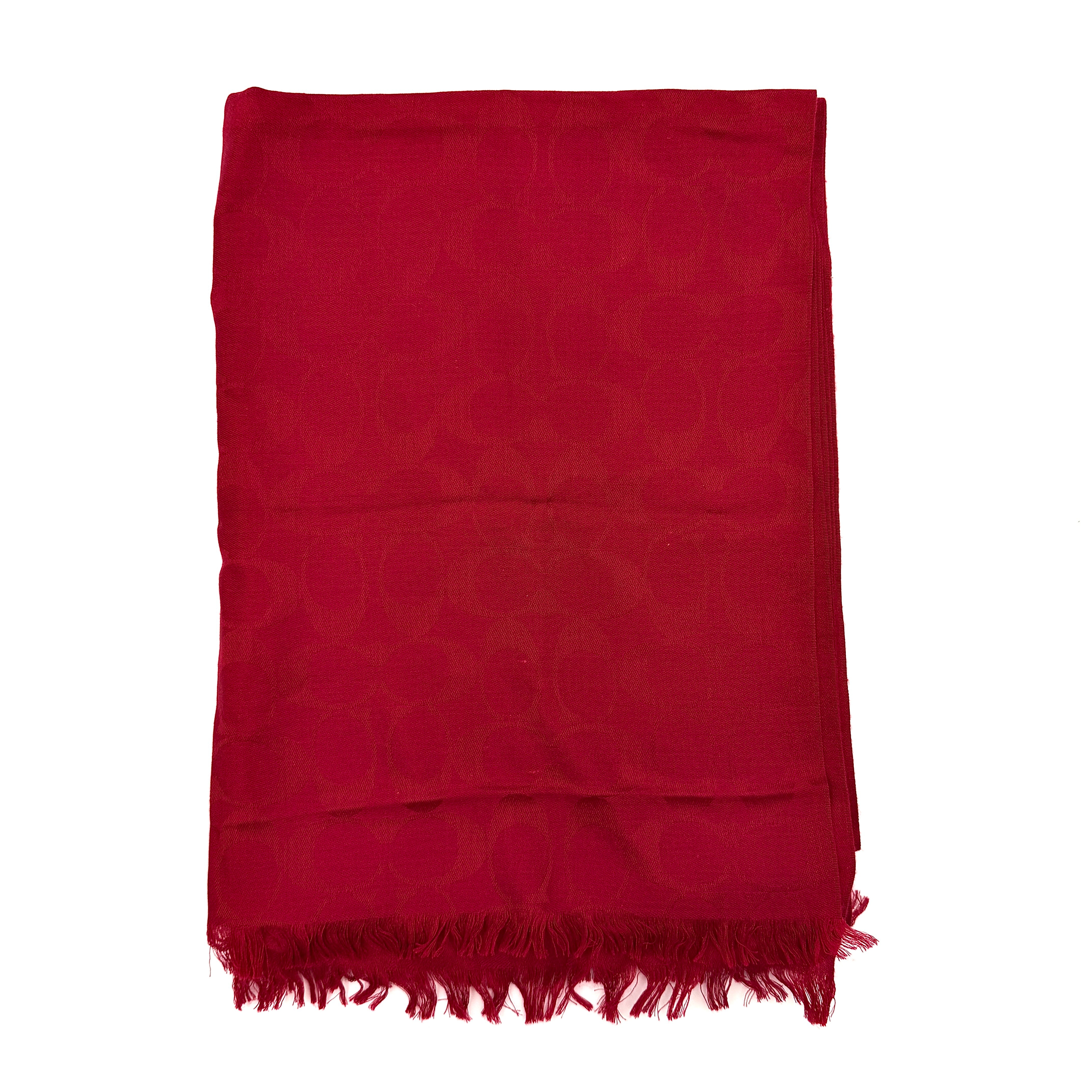 Coach Signature Monogram Wool Scarf in vibrant red wool and silk with tonal logo pattern and delicate fringe edging.