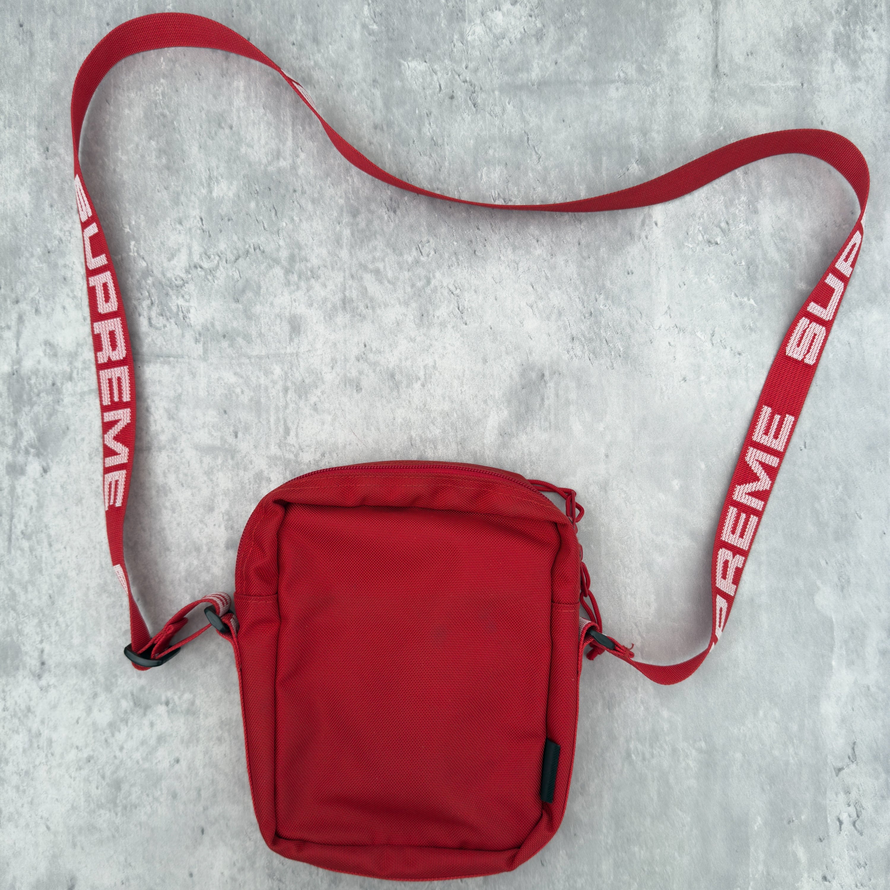Supreme Shoulder Bag Red (SS18), made from Cordura® fabric with an adjustable Supreme-branded strap and zippered compartments.