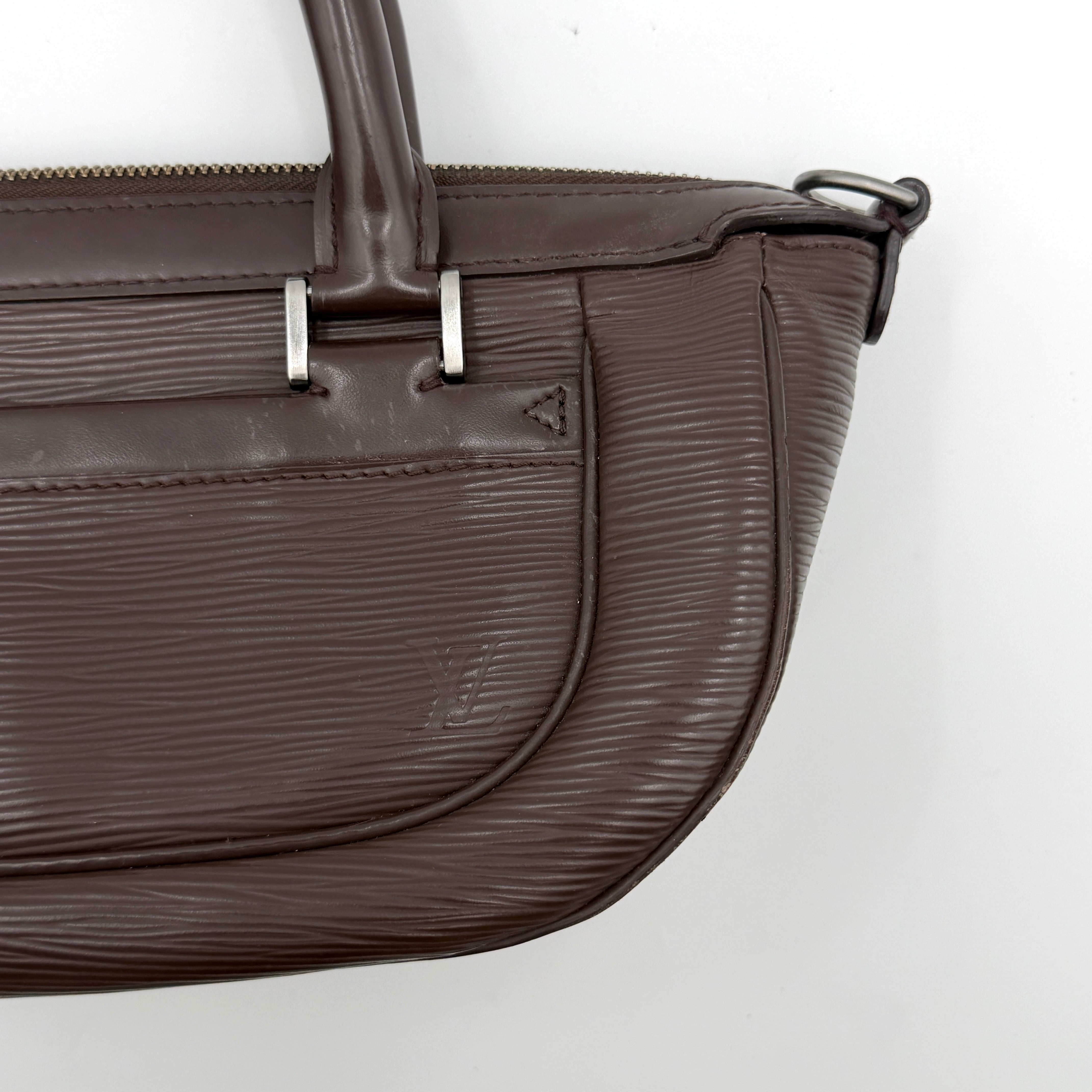 Louis Vuitton Dhanura PM 2Way shoulder bag in brown Epi leather with detachable strap and silver-tone hardware.