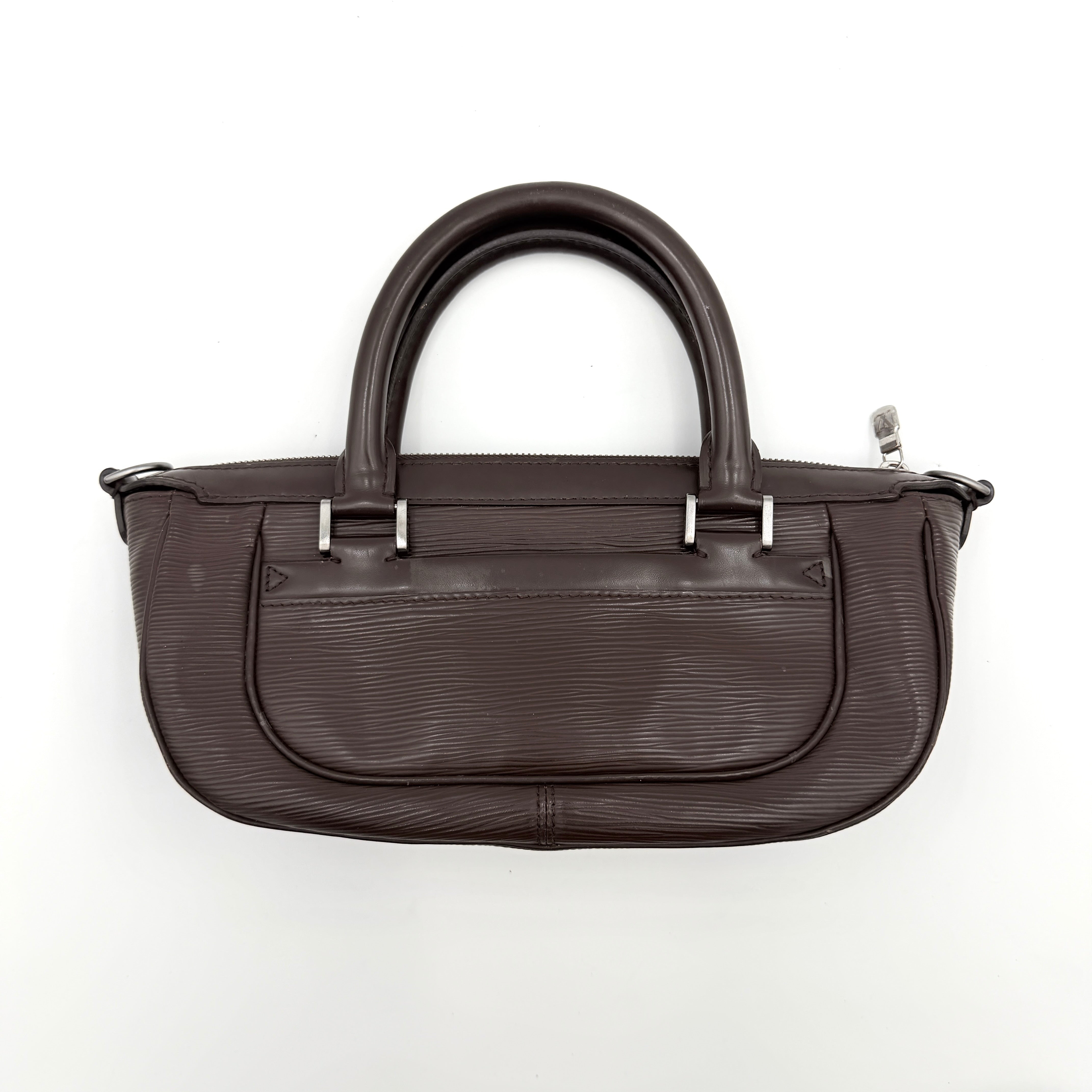 Louis Vuitton Dhanura PM 2Way shoulder bag in brown Epi leather with detachable strap and silver-tone hardware.