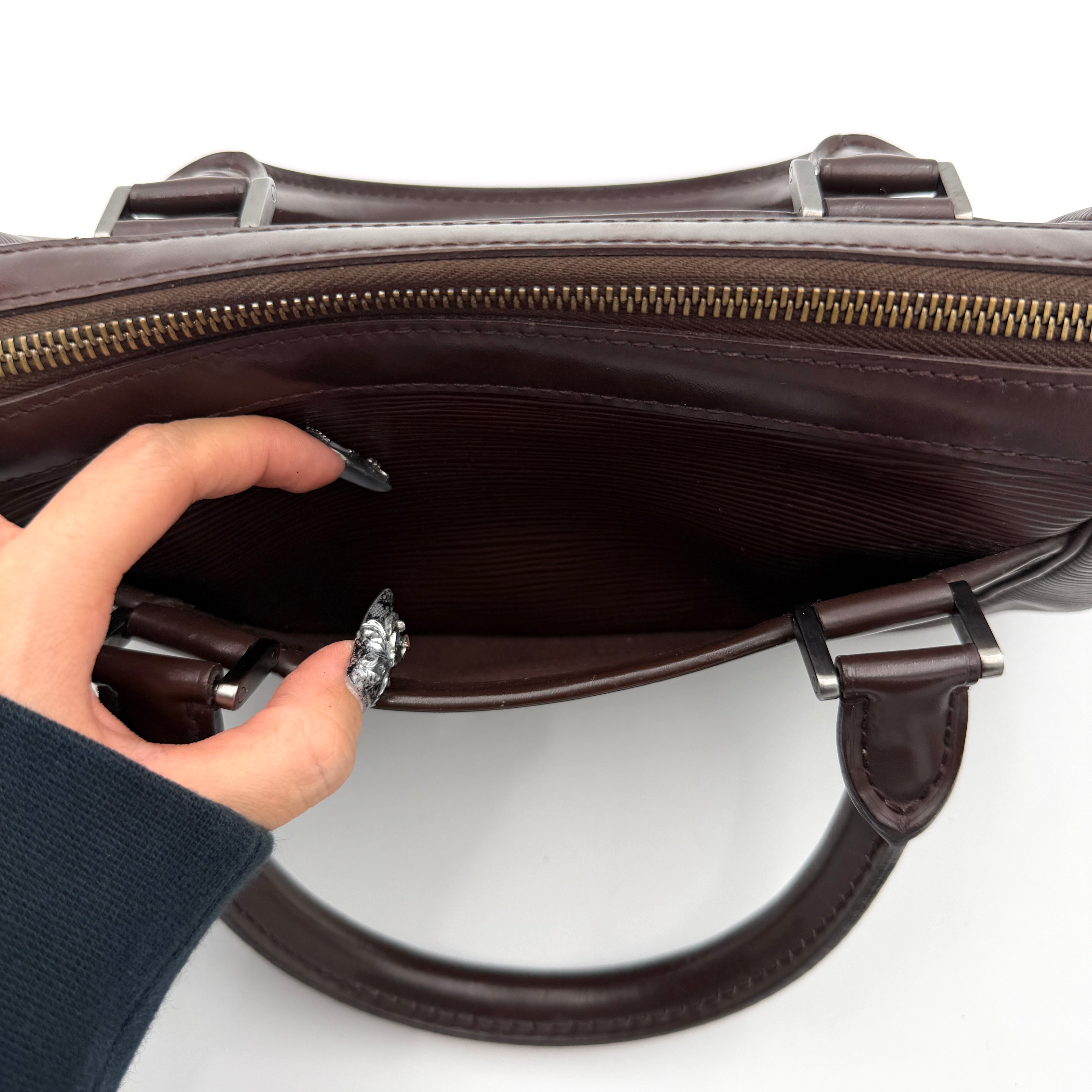 Louis Vuitton Dhanura PM 2Way shoulder bag in brown Epi leather with detachable strap and silver-tone hardware.