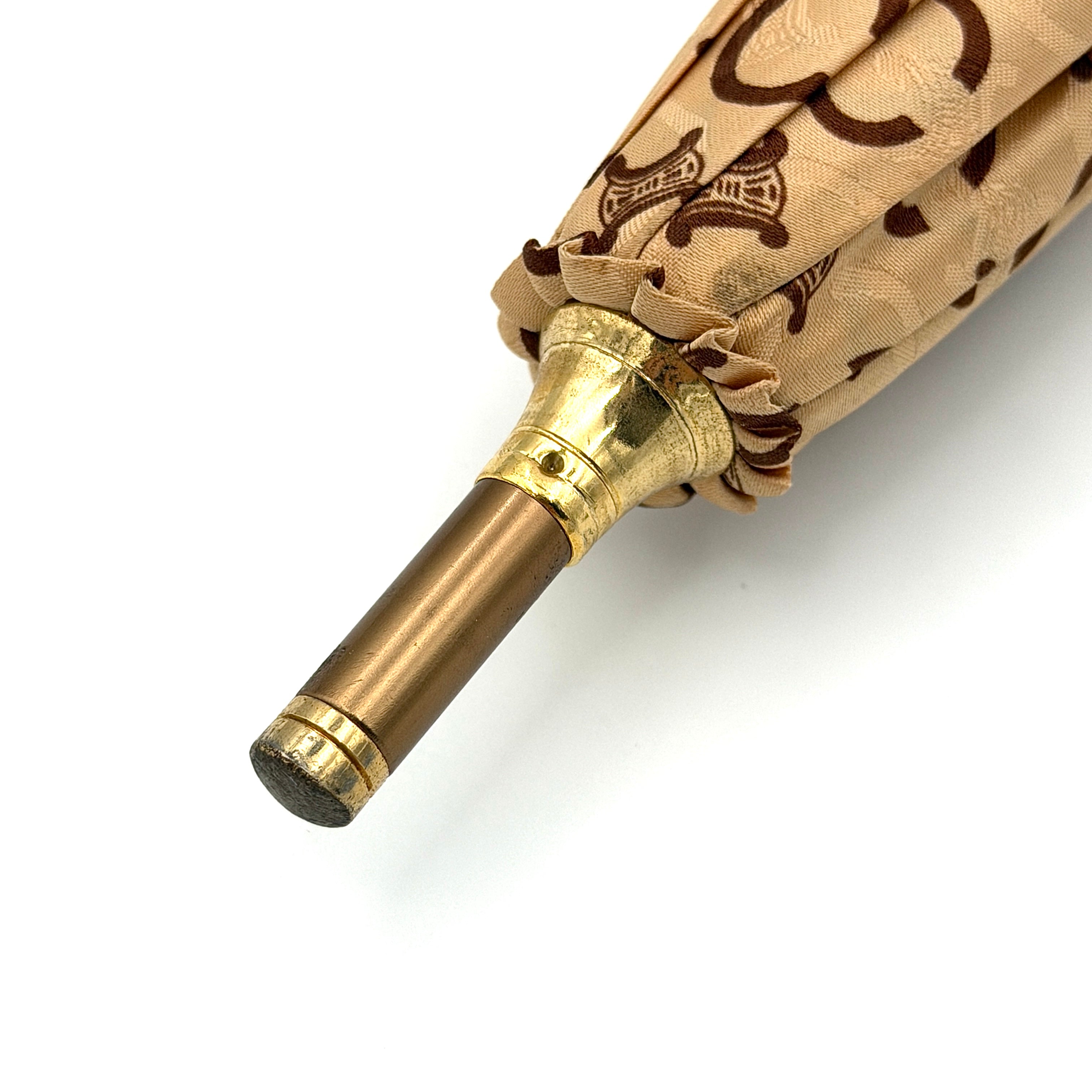Celine Macadam Monogram Umbrella in brown and beige with classic curved handle and signature all-over logo pattern.