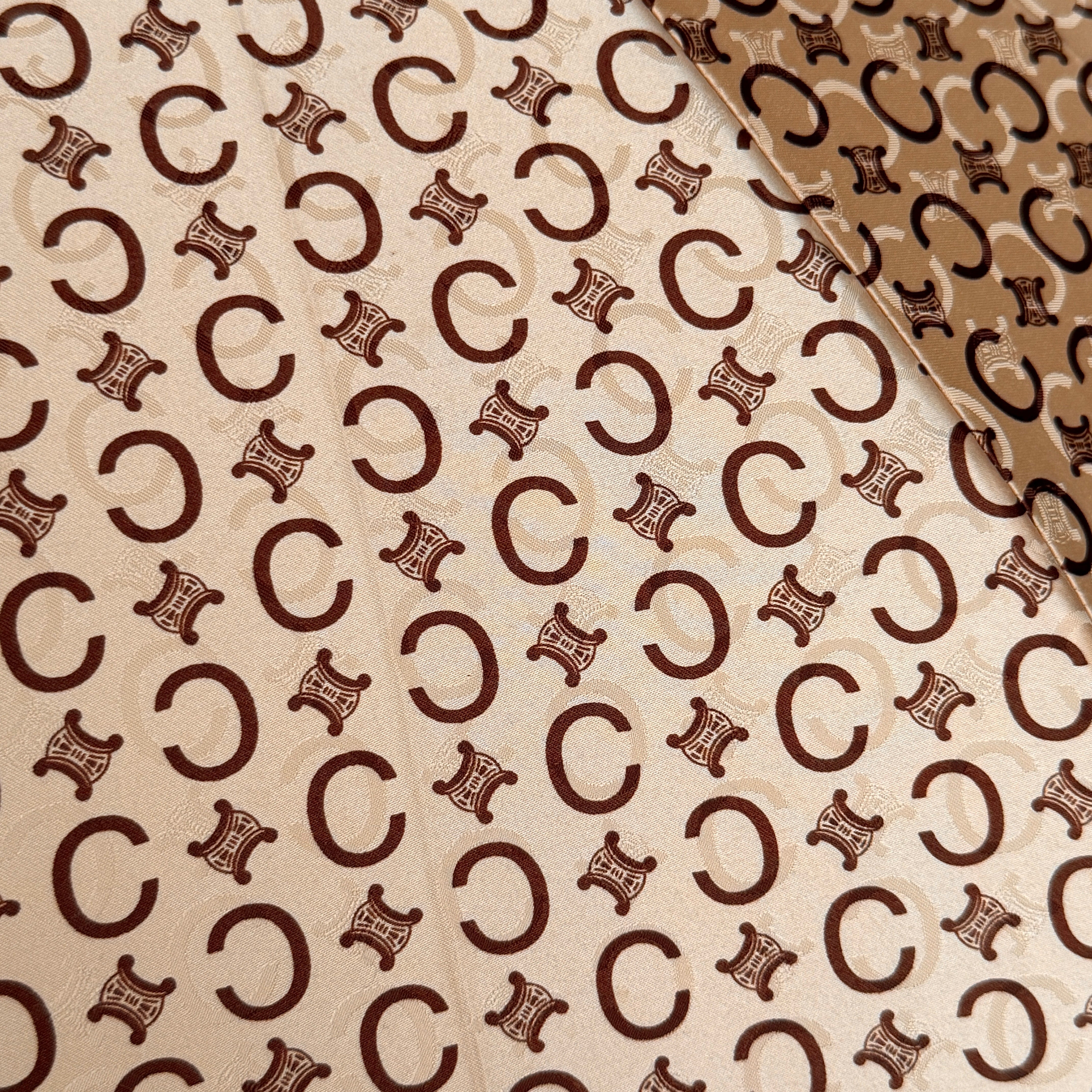 Celine Macadam Monogram Umbrella in brown and beige with classic curved handle and signature all-over logo pattern.