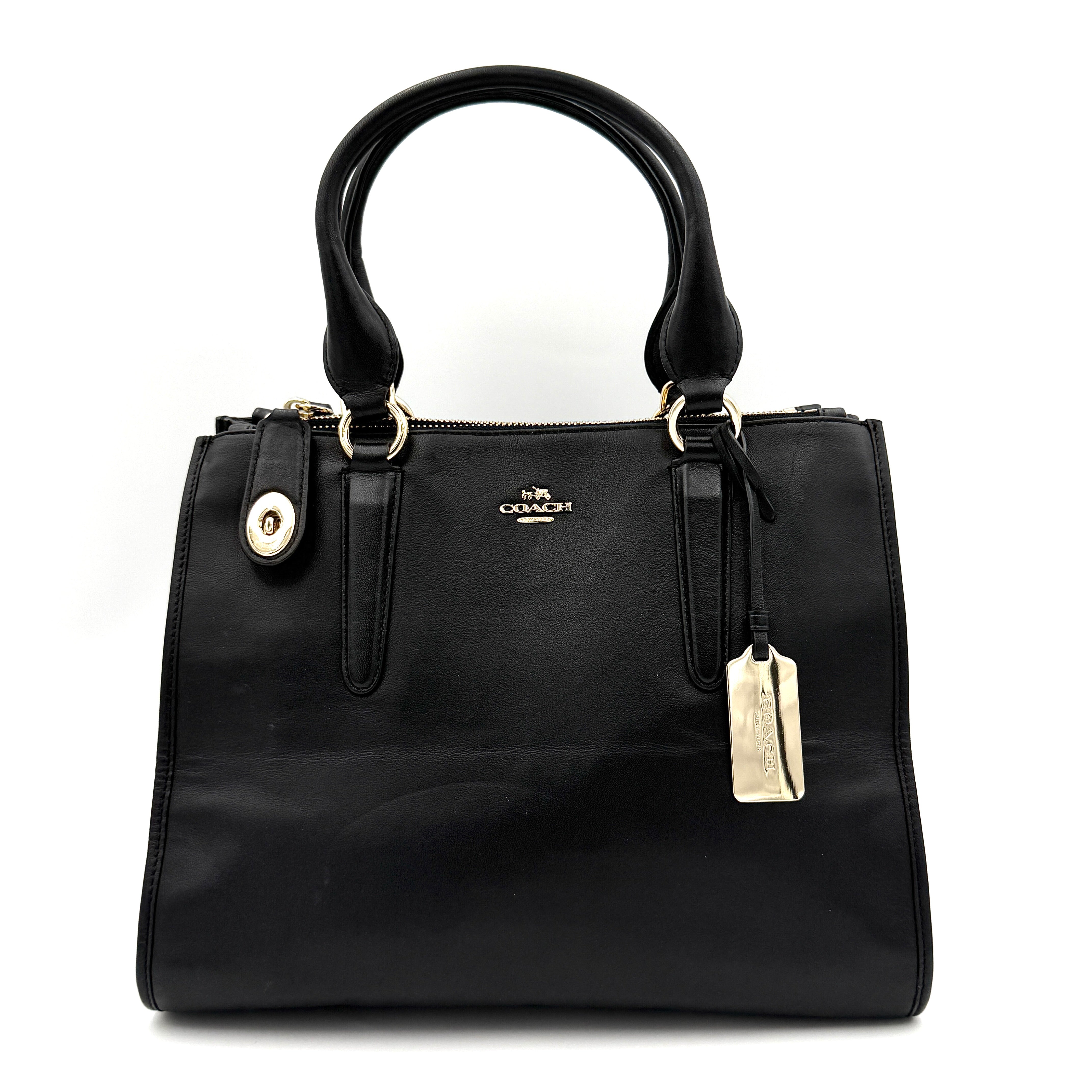 Coach Crosby Carryall Handbag in smooth black leather with gold-tone hardware and a structured silhouette.