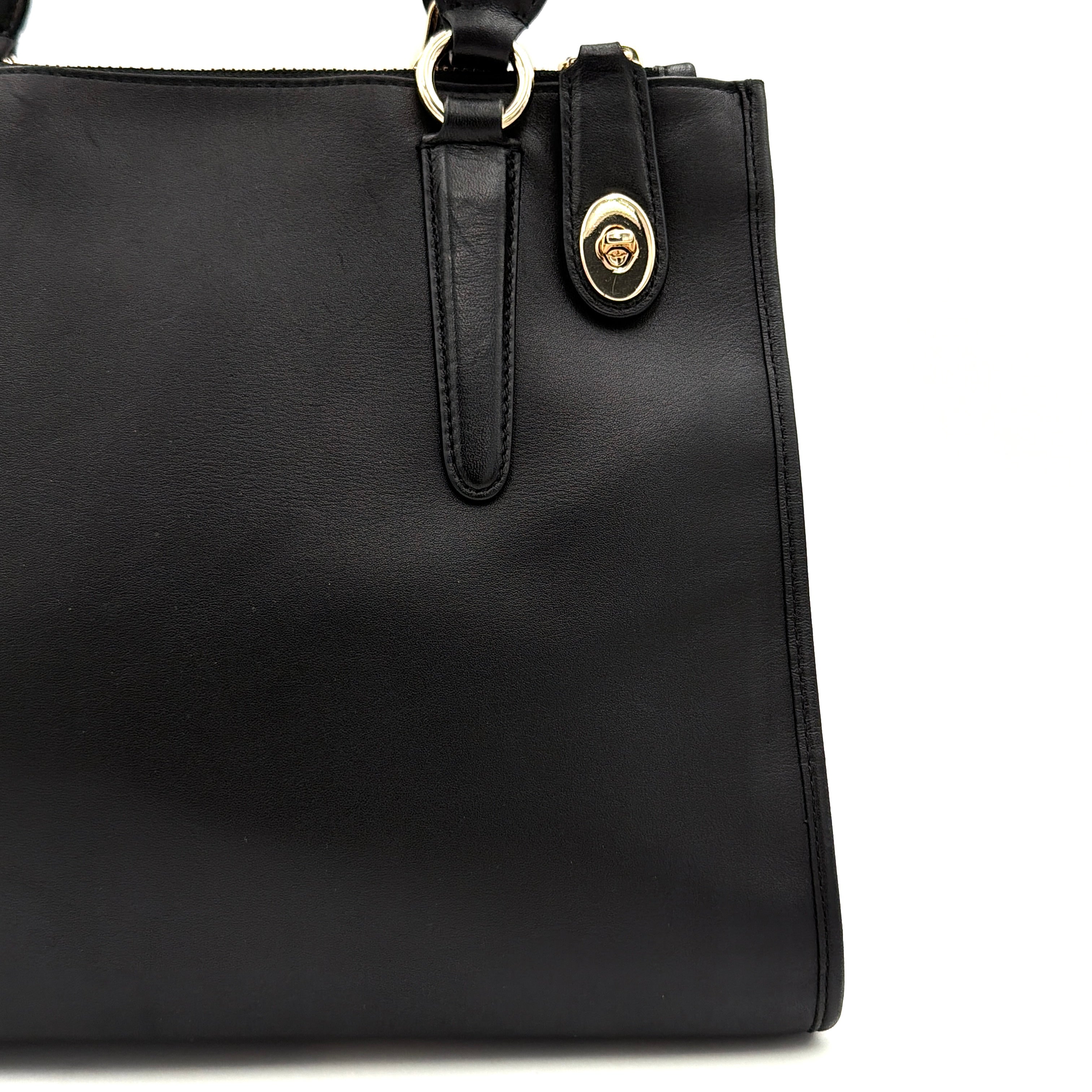 Coach Crosby Carryall Handbag in smooth black leather with gold-tone hardware and a structured silhouette.
