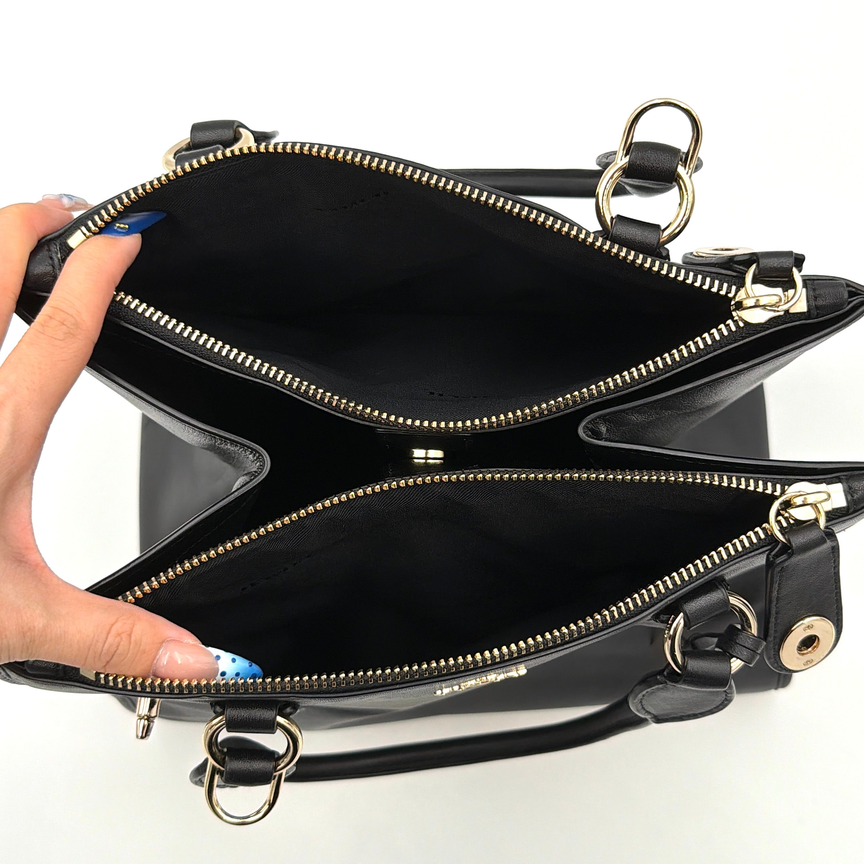 Coach Crosby Carryall Handbag in smooth black leather with gold-tone hardware and a structured silhouette.