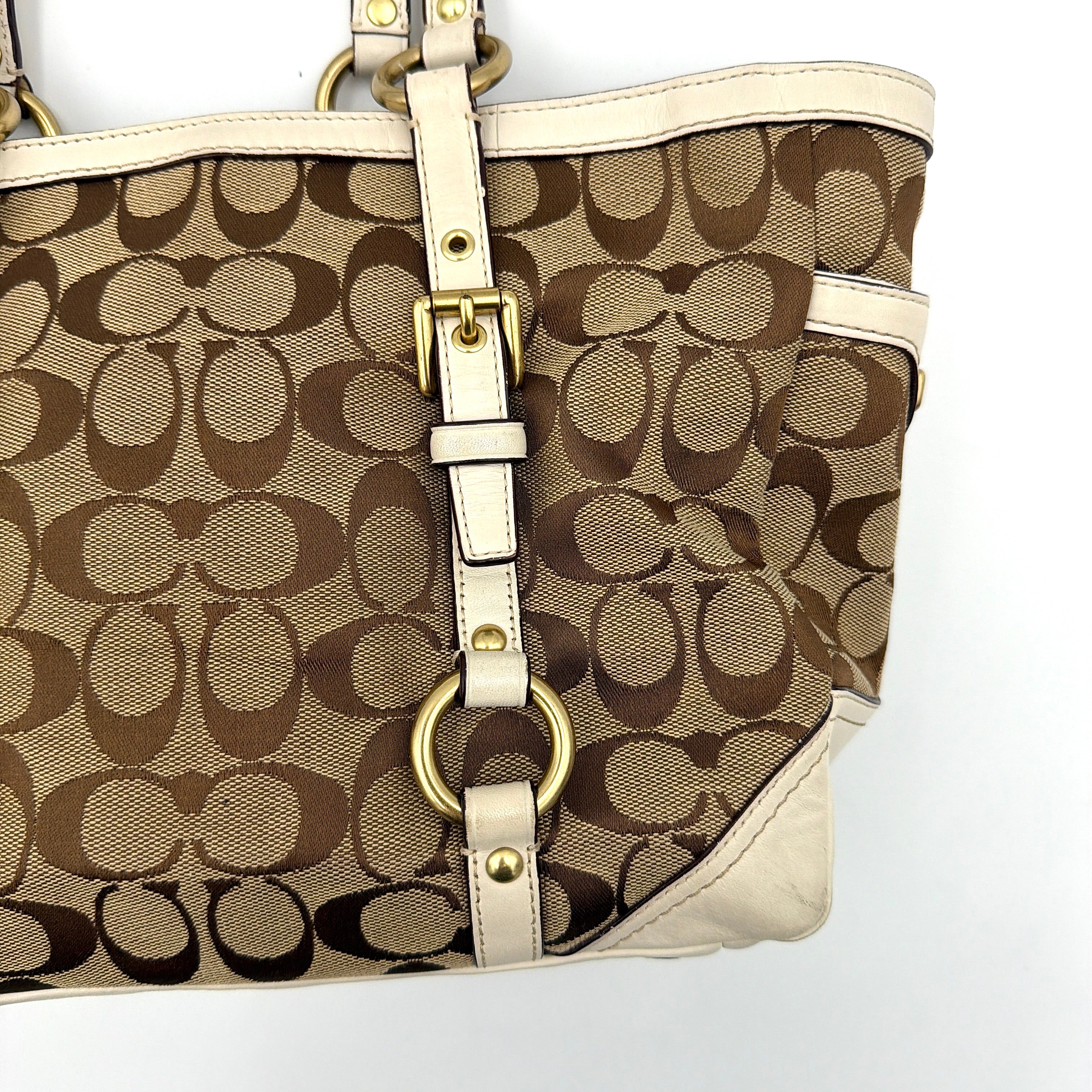 Coach Signature Gallery Tote Bag in beige jacquard canvas with cream leather trim, belted accents, and gold-tone hardware.