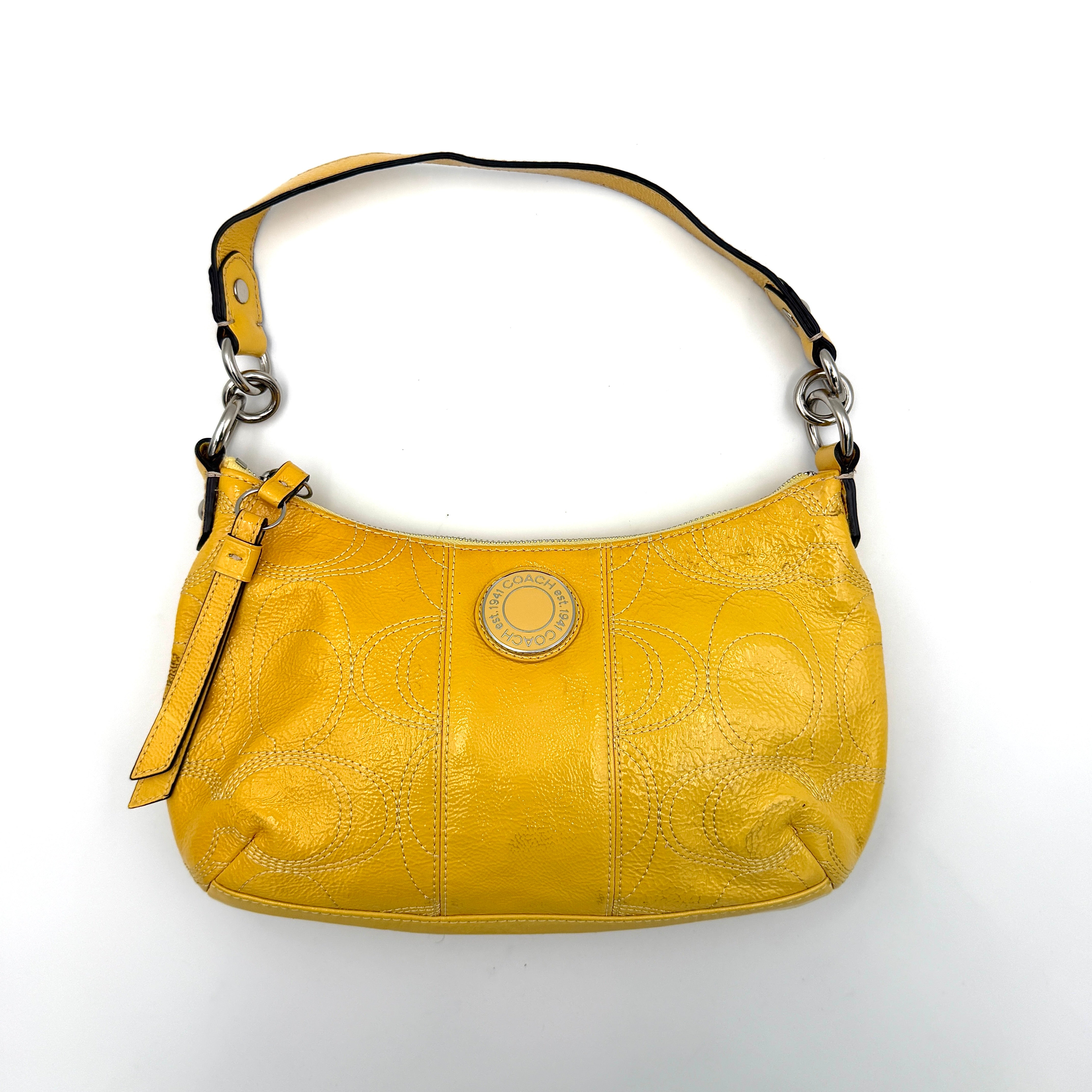 Coach 2Way Signature Stripe Patent Shoulder Bag in patent sunflower yellow leather with signature stitching and detachable strap displayed.
