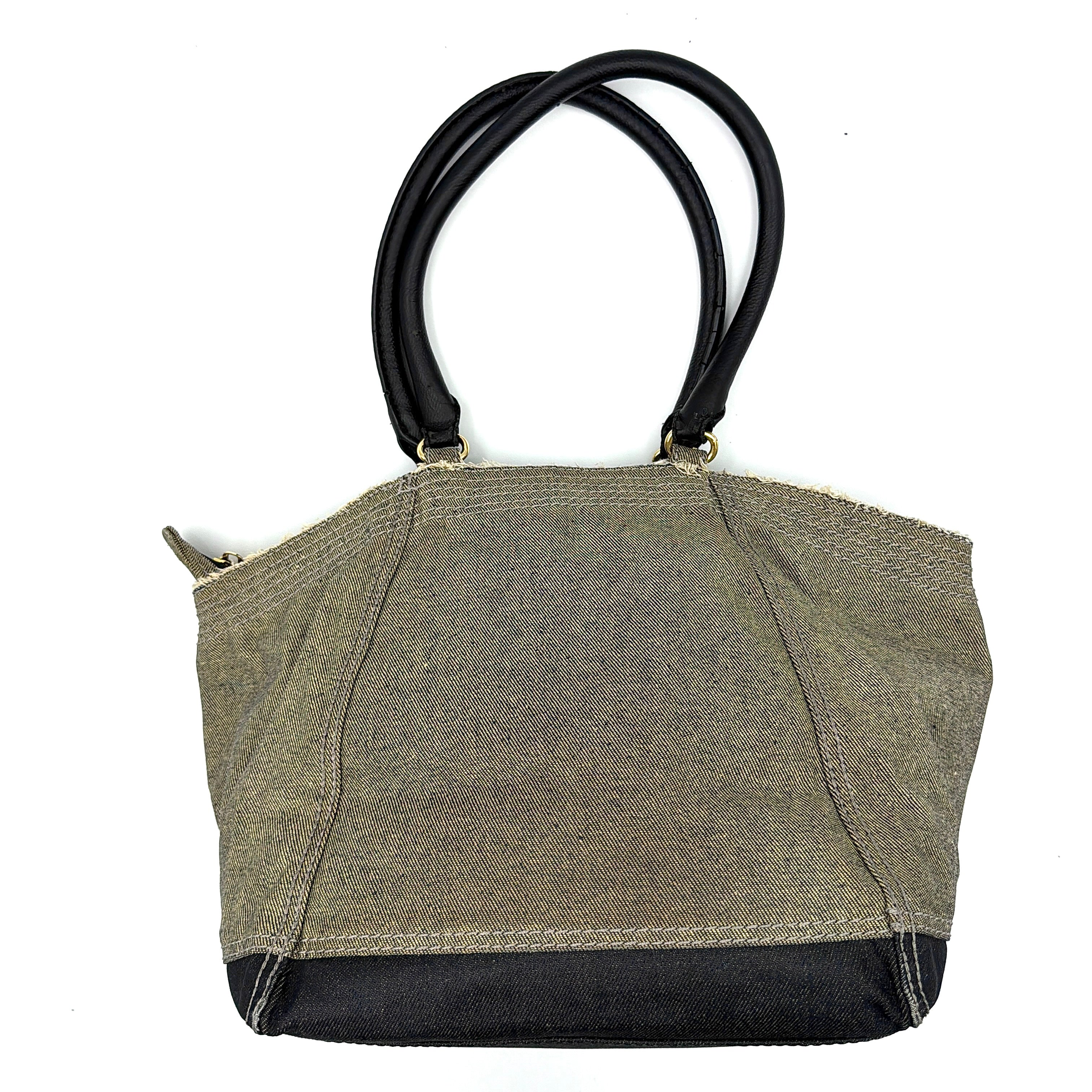 Diesel washed denim shoulder bag with black leather handles, gold zips and frayed edge detail.