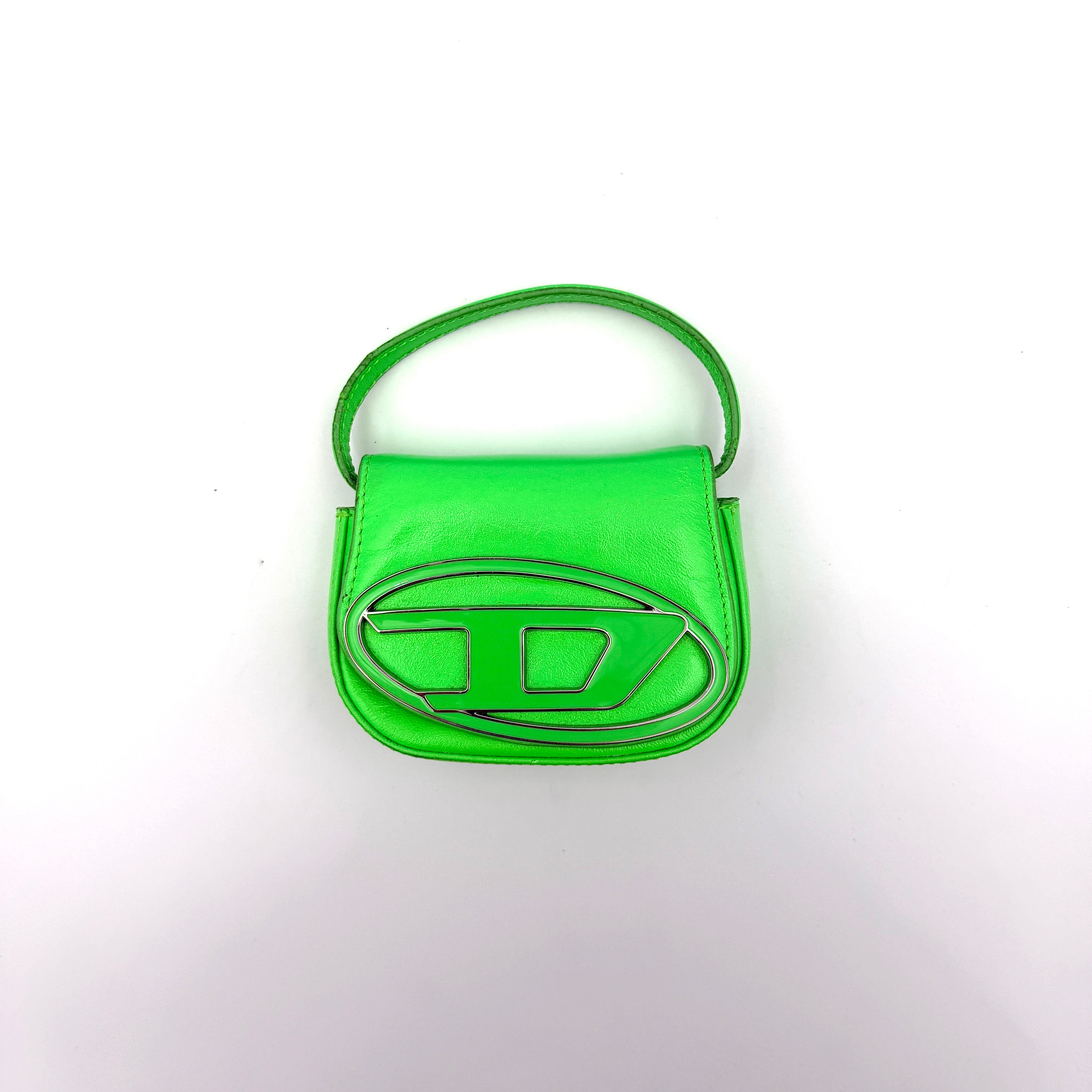 Diesel 1DR-XS Mini Bag in vivid neon green leather with bold silver D plaque and detachable strap, presented against a clean background.