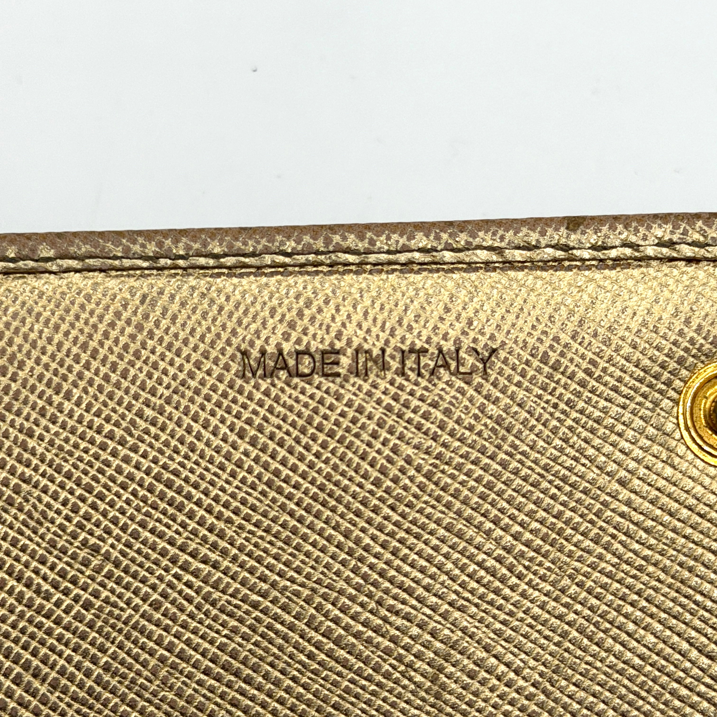 Prada Saffiano Continental Long Wallet in metallic gold Saffiano leather with gold-tone logo and structured silhouette.