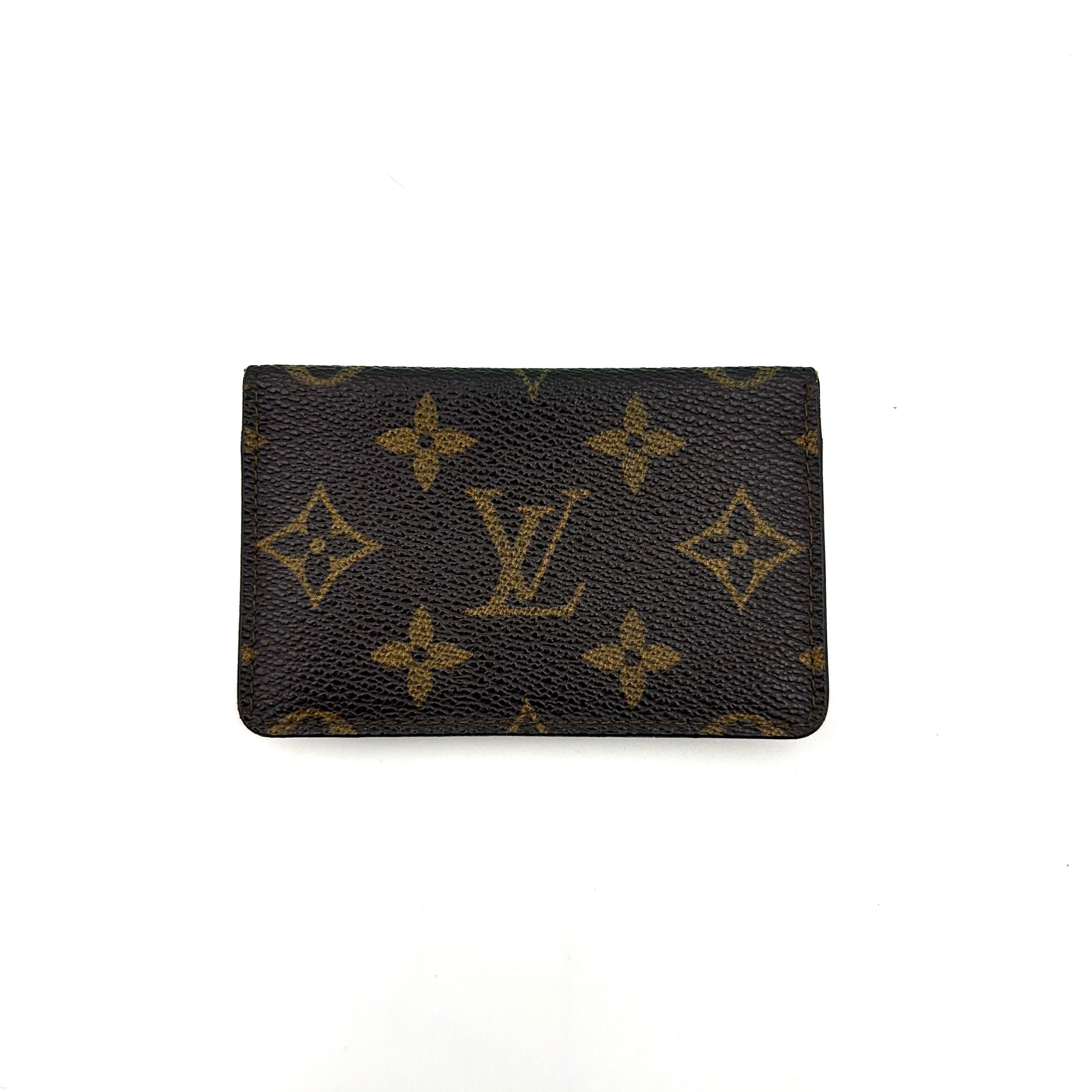 Louis Vuitton Monogram Pocket Organizer Cardholder in brown canvas with iconic LV and floral motifs, showcased front-facing against a white background.
