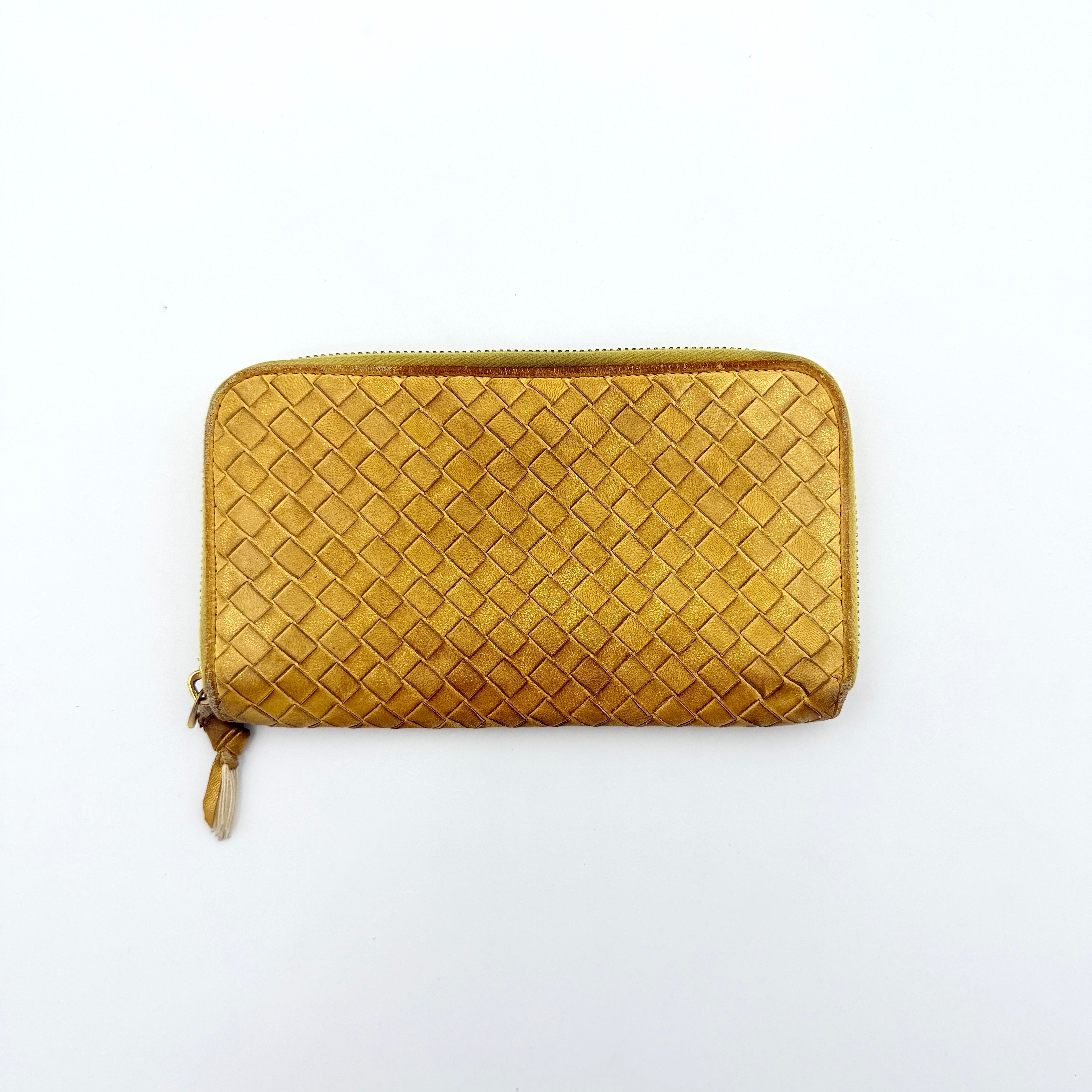 Bottega Veneta yellow Intrecciato woven leather long wallet with gold zip-around closure and signature leather pull.