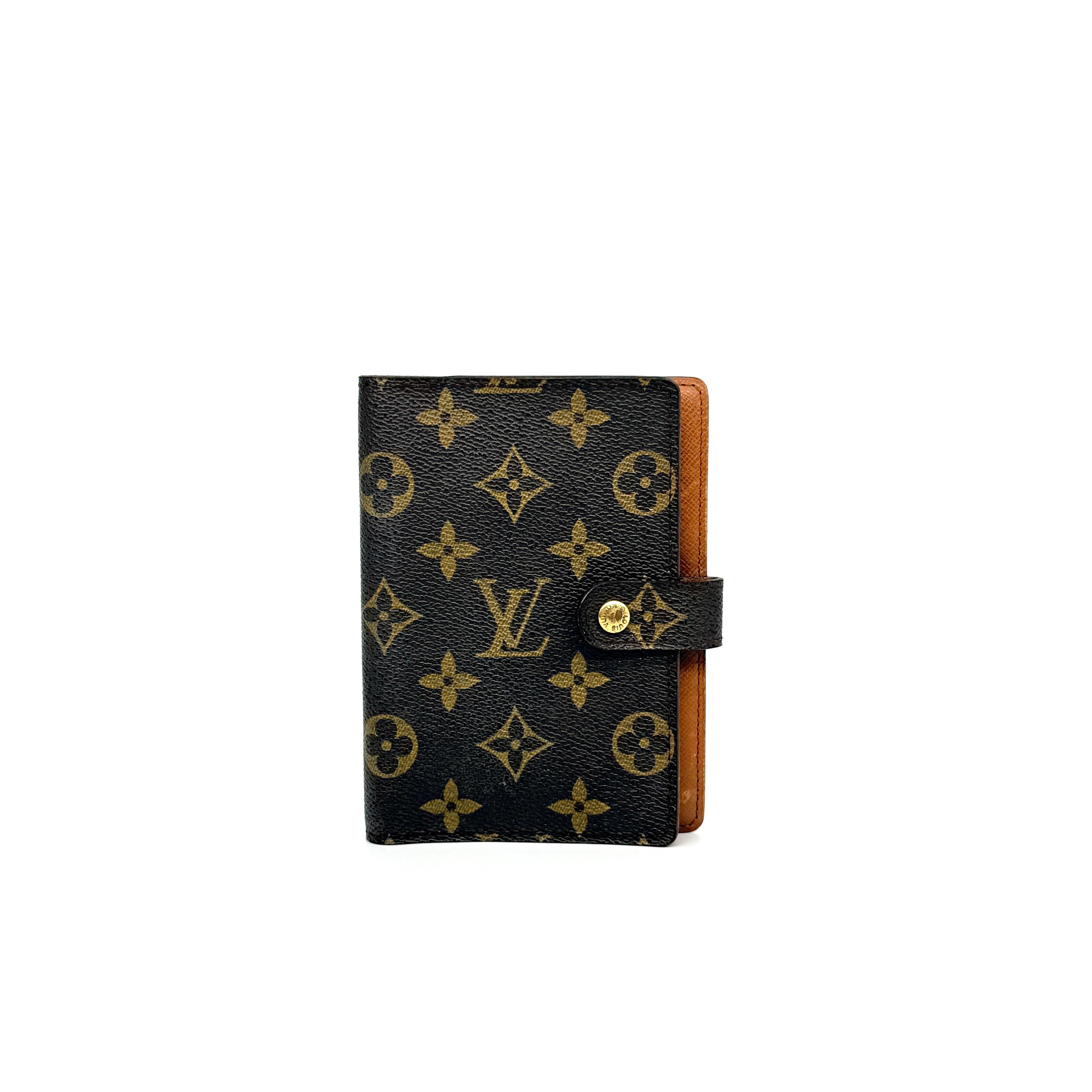 Louis Vuitton Monogram Agenda Cover in brown canvas with gold snap closure, displayed against a white background.