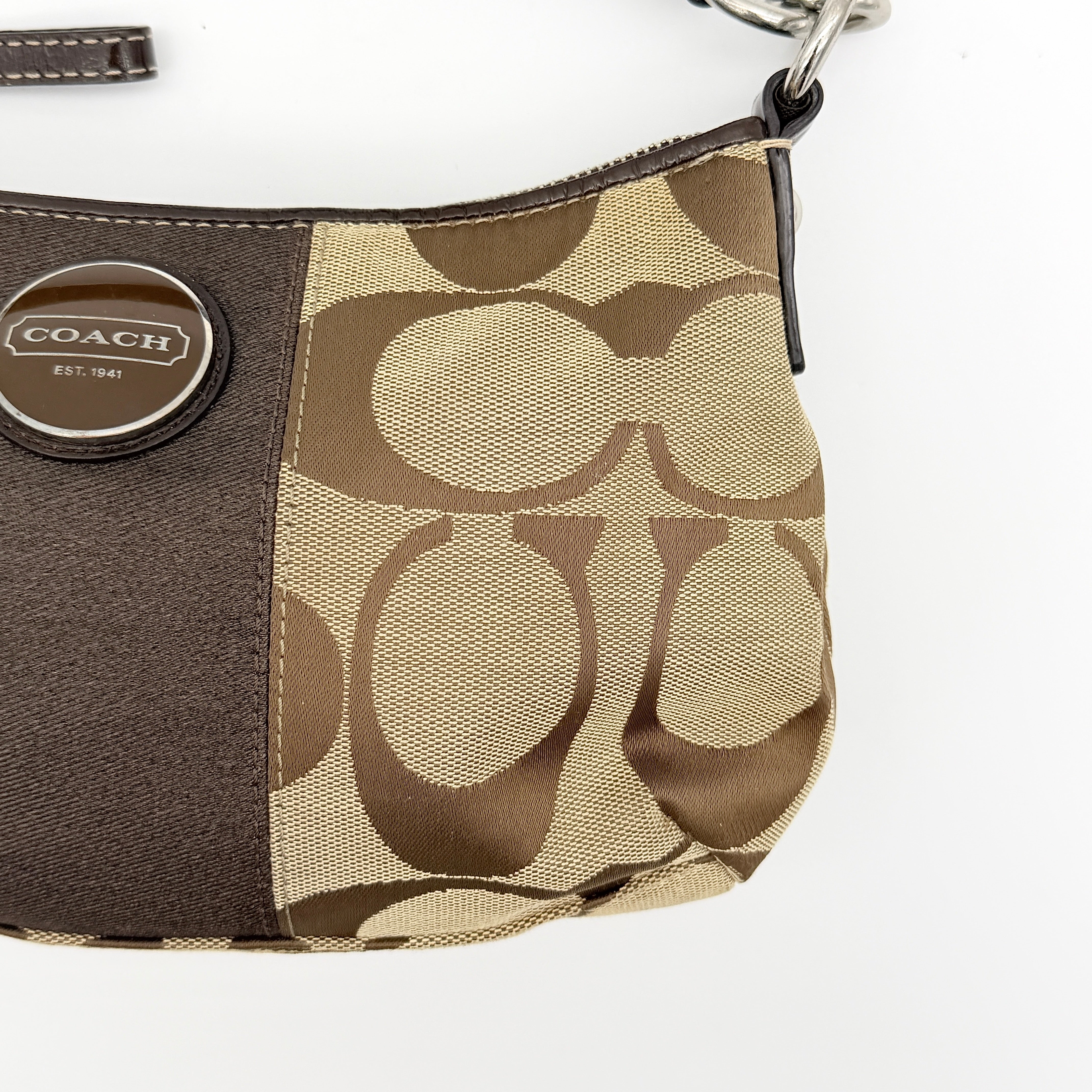 Coach beige and brown 2Way Signature Stripe shoulder bag with silver hardware, leather trim, and detachable straps.