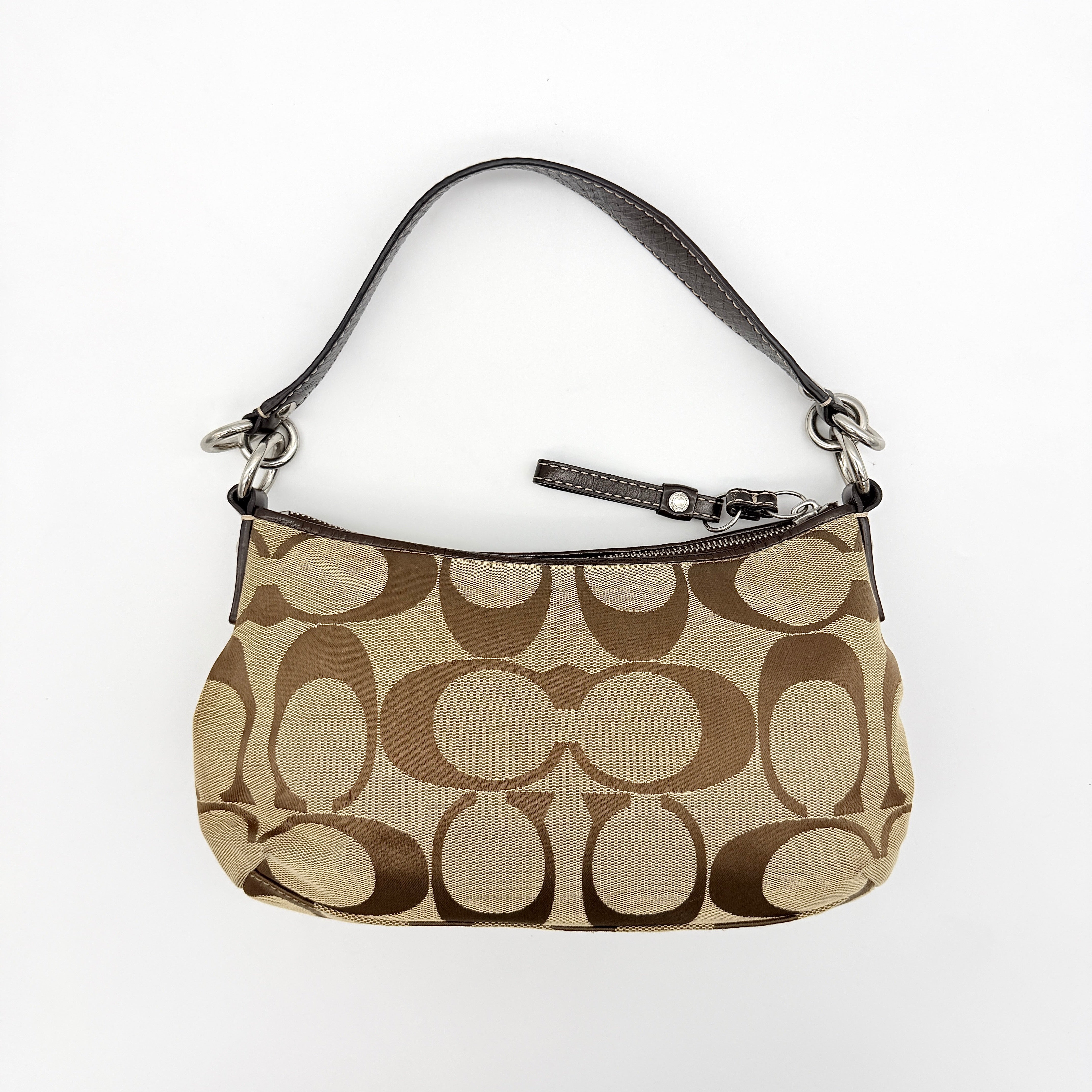 Coach beige and brown 2Way Signature Stripe shoulder bag with silver hardware, leather trim, and detachable straps.