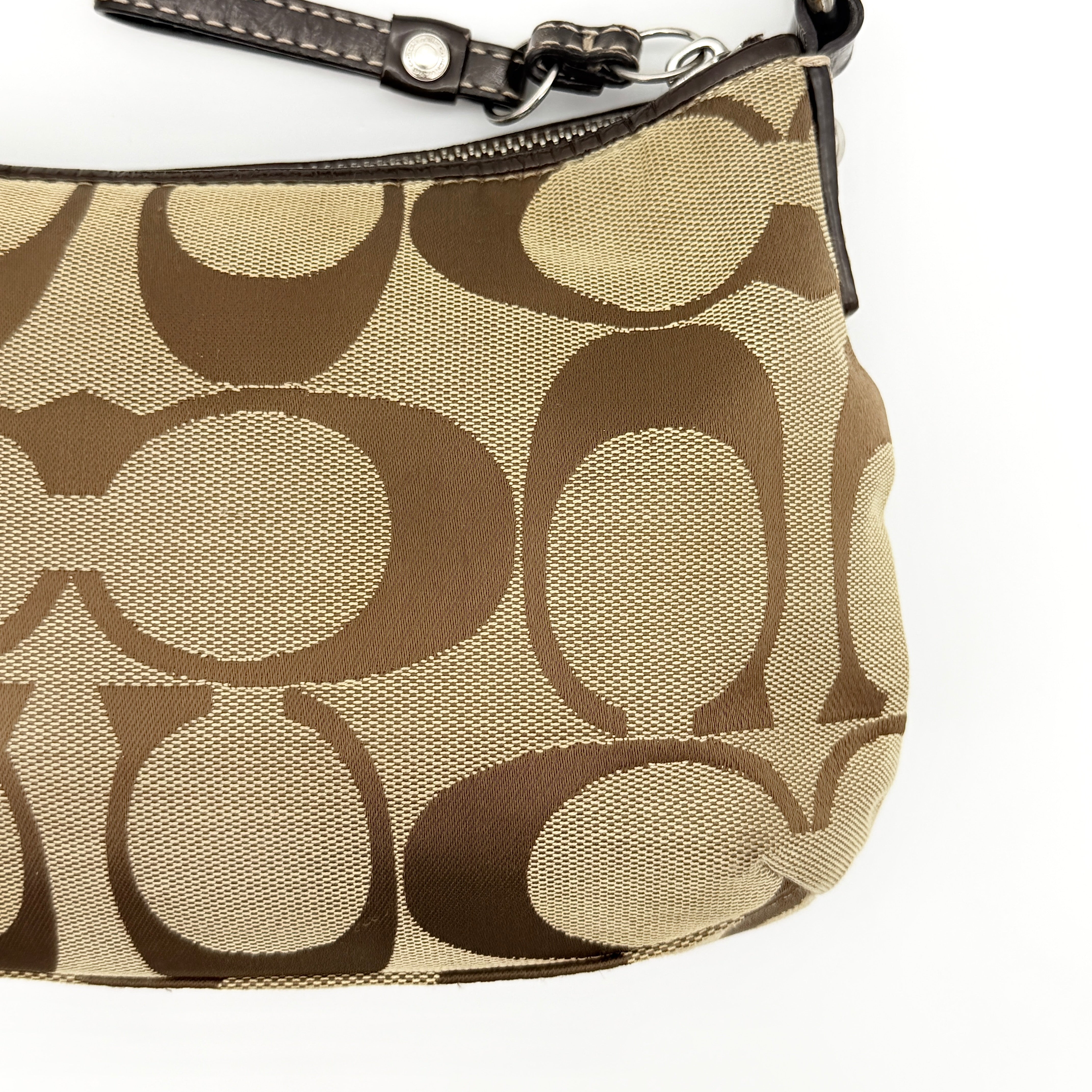 Coach beige and brown 2Way Signature Stripe shoulder bag with silver hardware, leather trim, and detachable straps.