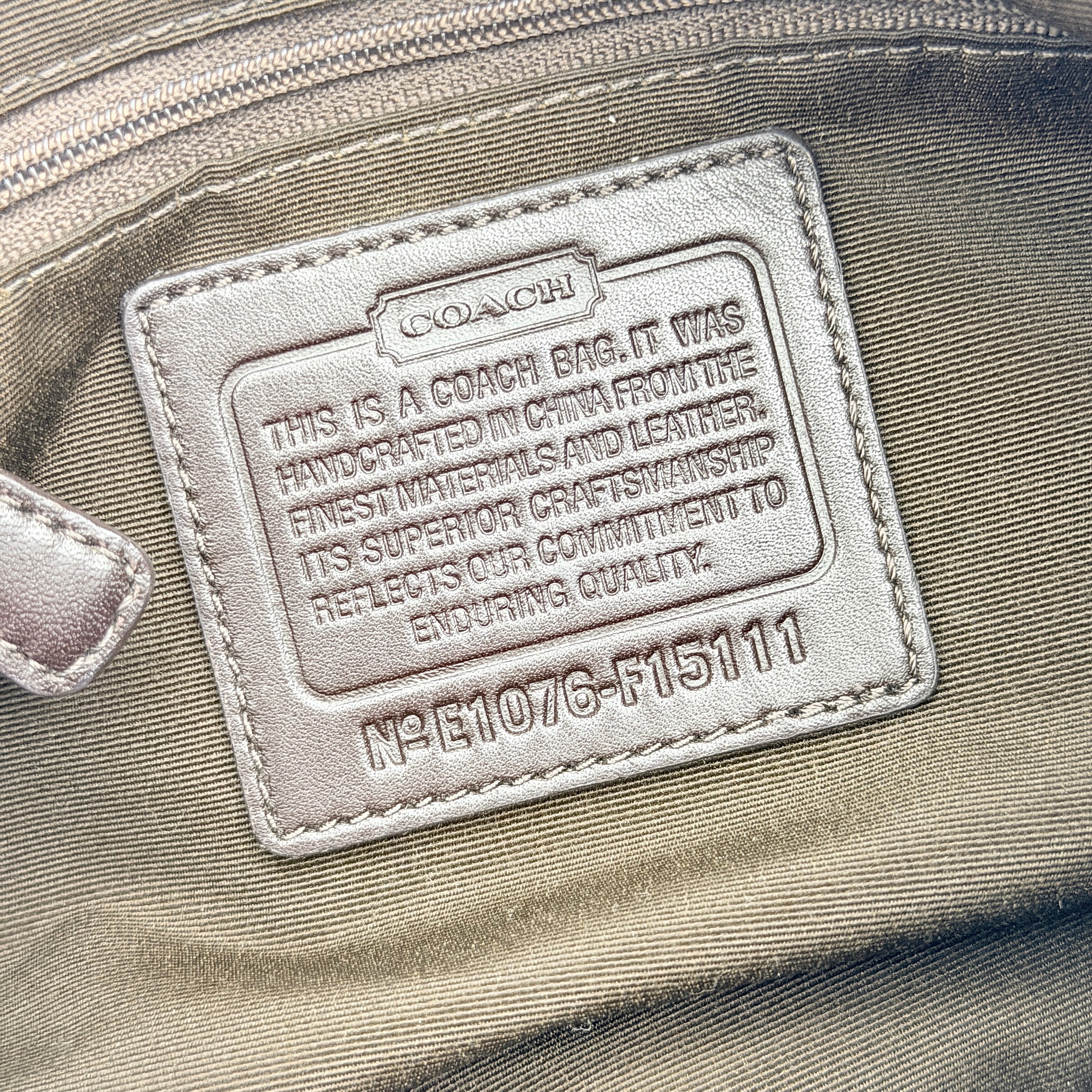 Coach beige and brown 2Way Signature Stripe shoulder bag with silver hardware, leather trim, and detachable straps.