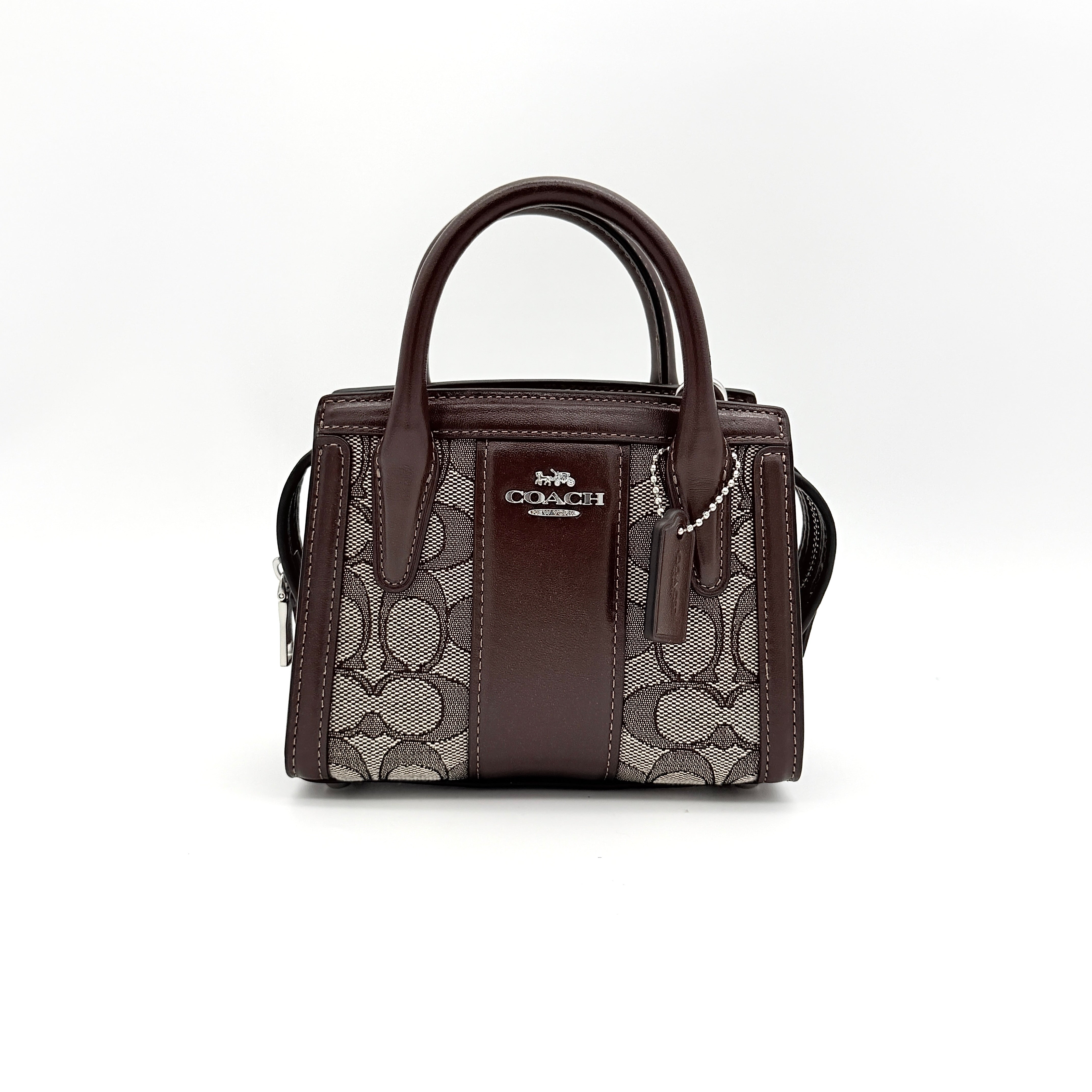 Front view of the Coach Signature Mini Andrea Carryall Shoulder Bag in brown canvas and leather with silver hardware.
