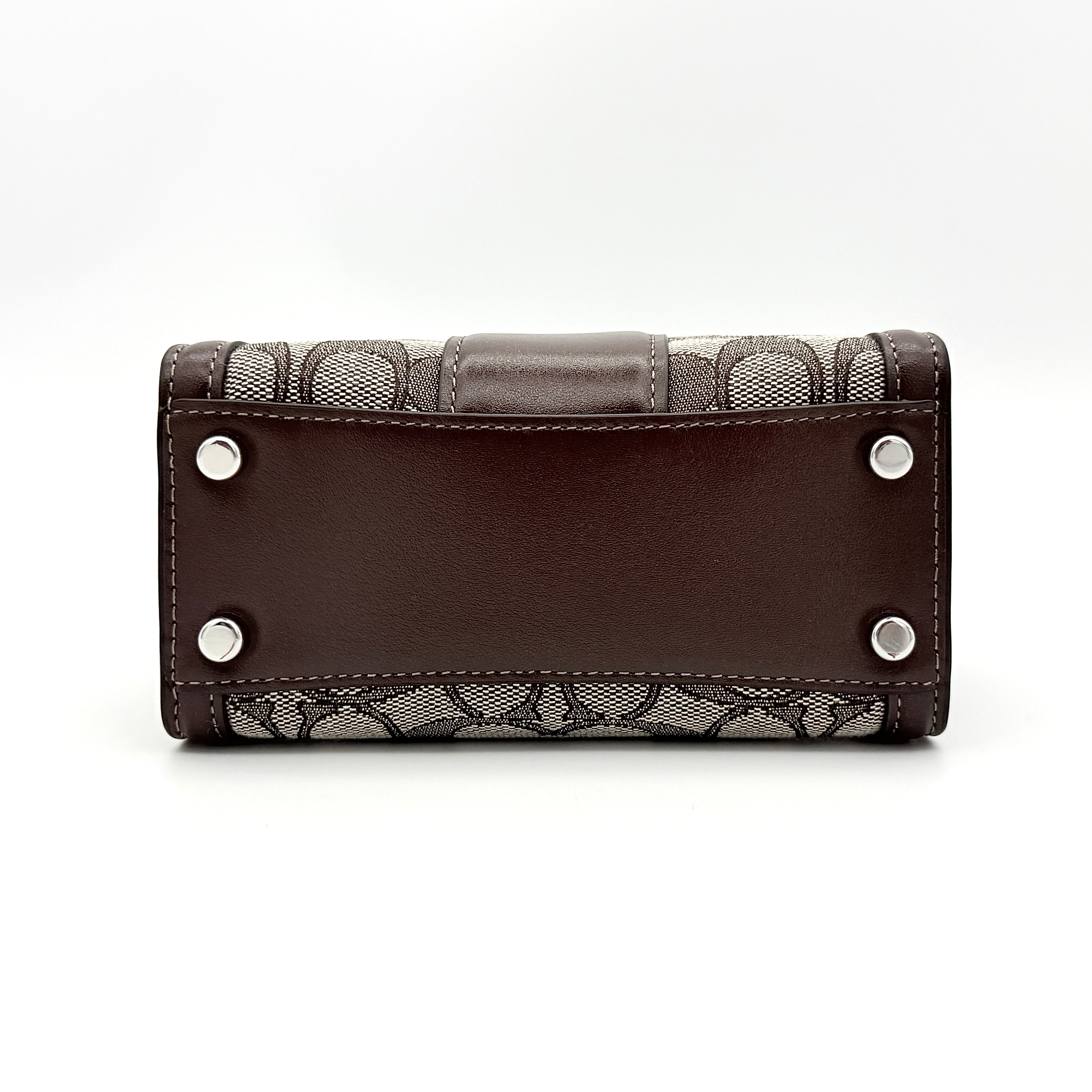 Front view of the Coach Signature Mini Andrea Carryall Shoulder Bag in brown canvas and leather with silver hardware.