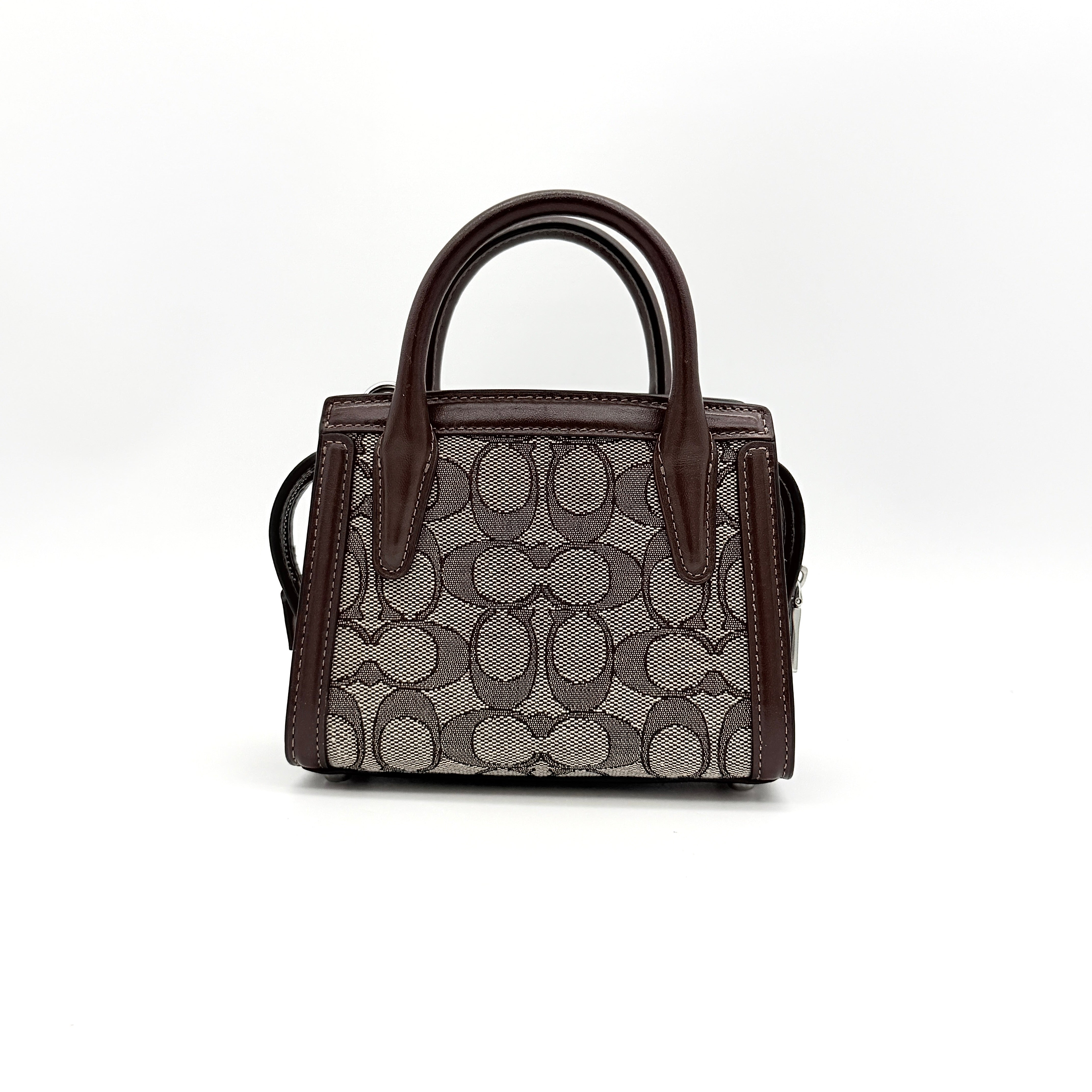 Front view of the Coach Signature Mini Andrea Carryall Shoulder Bag in brown canvas and leather with silver hardware.