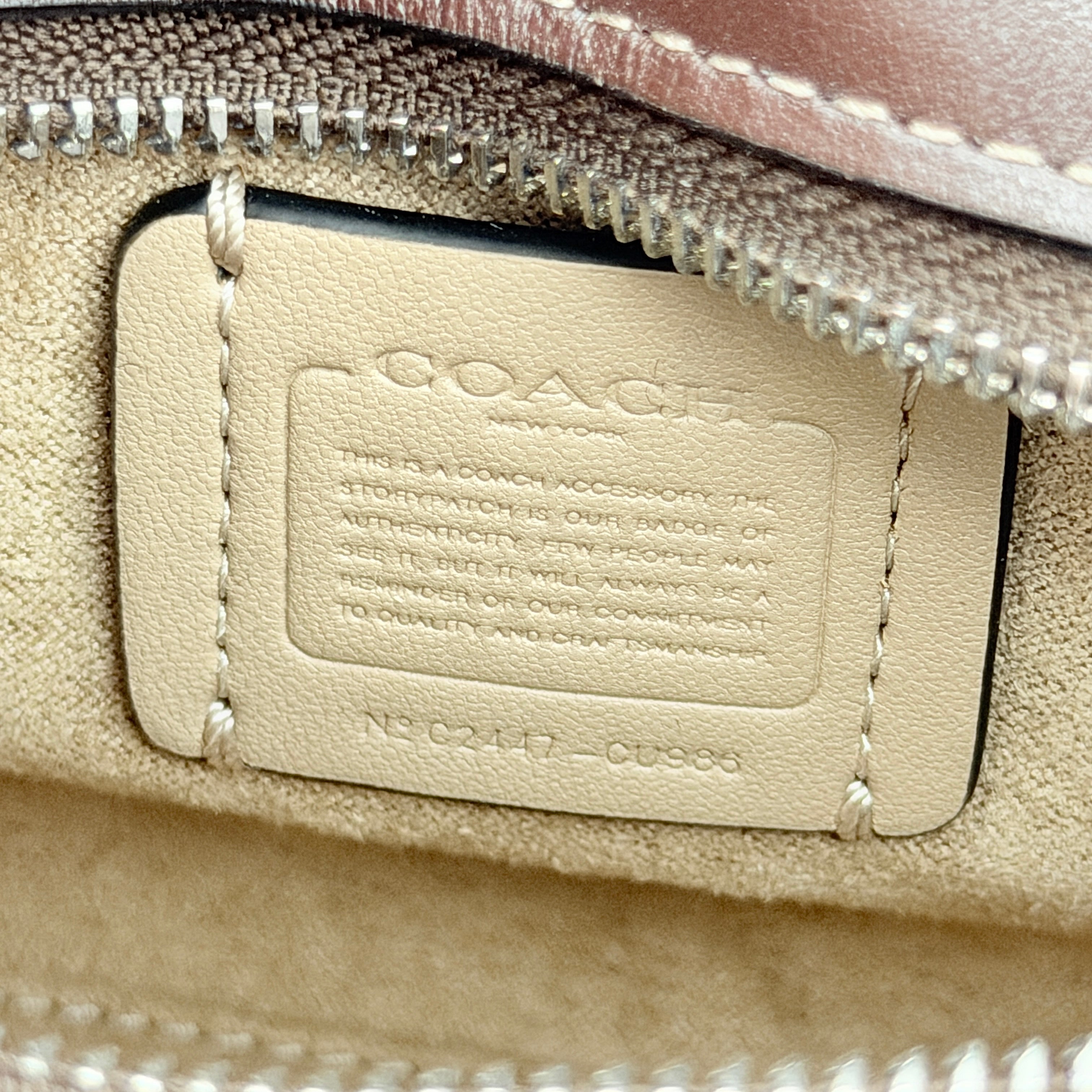 Front view of the Coach Signature Mini Andrea Carryall Shoulder Bag in brown canvas and leather with silver hardware.