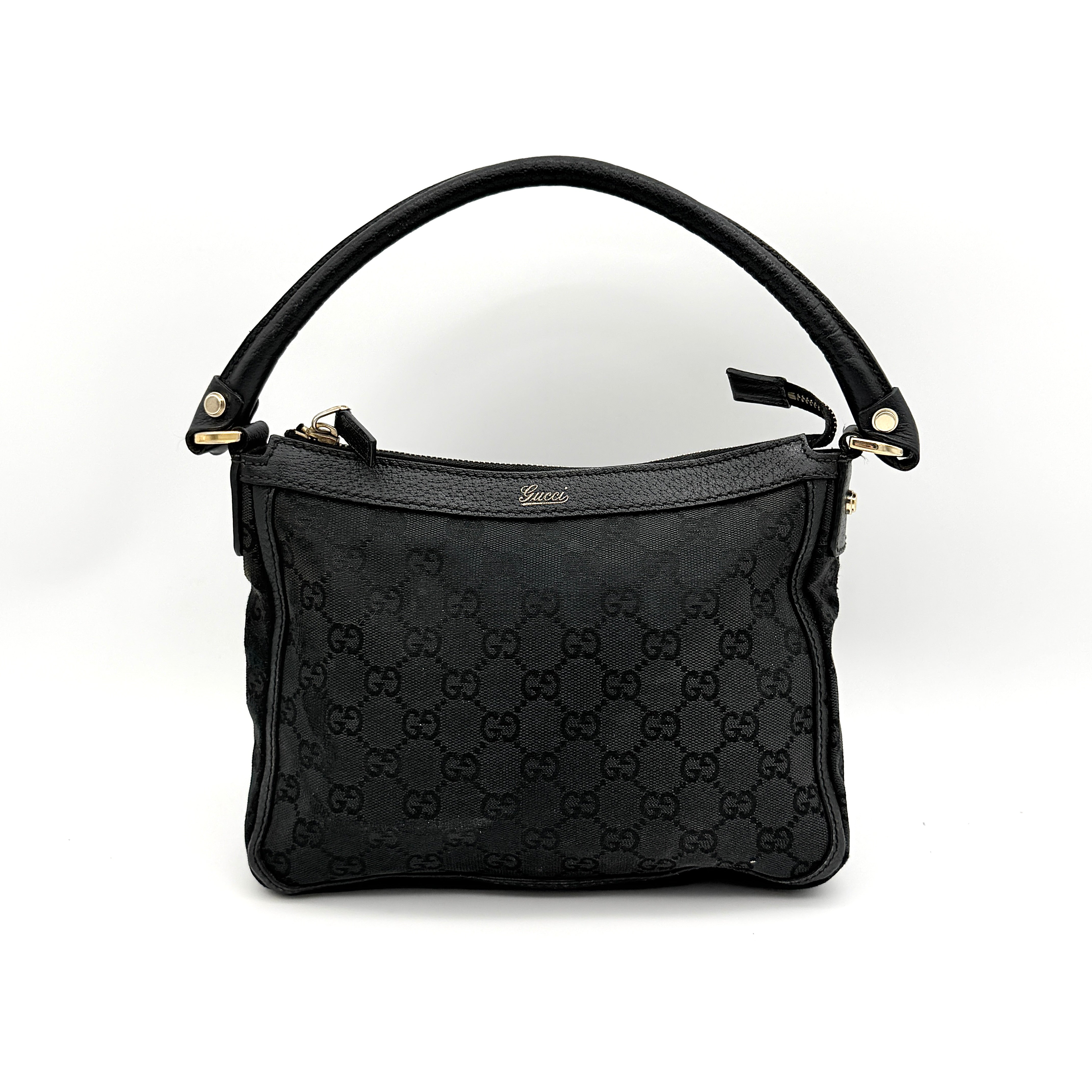 Front view of the Gucci GG Monogram Abbey Shoulder Bag in black with curved handle and gold hardware.