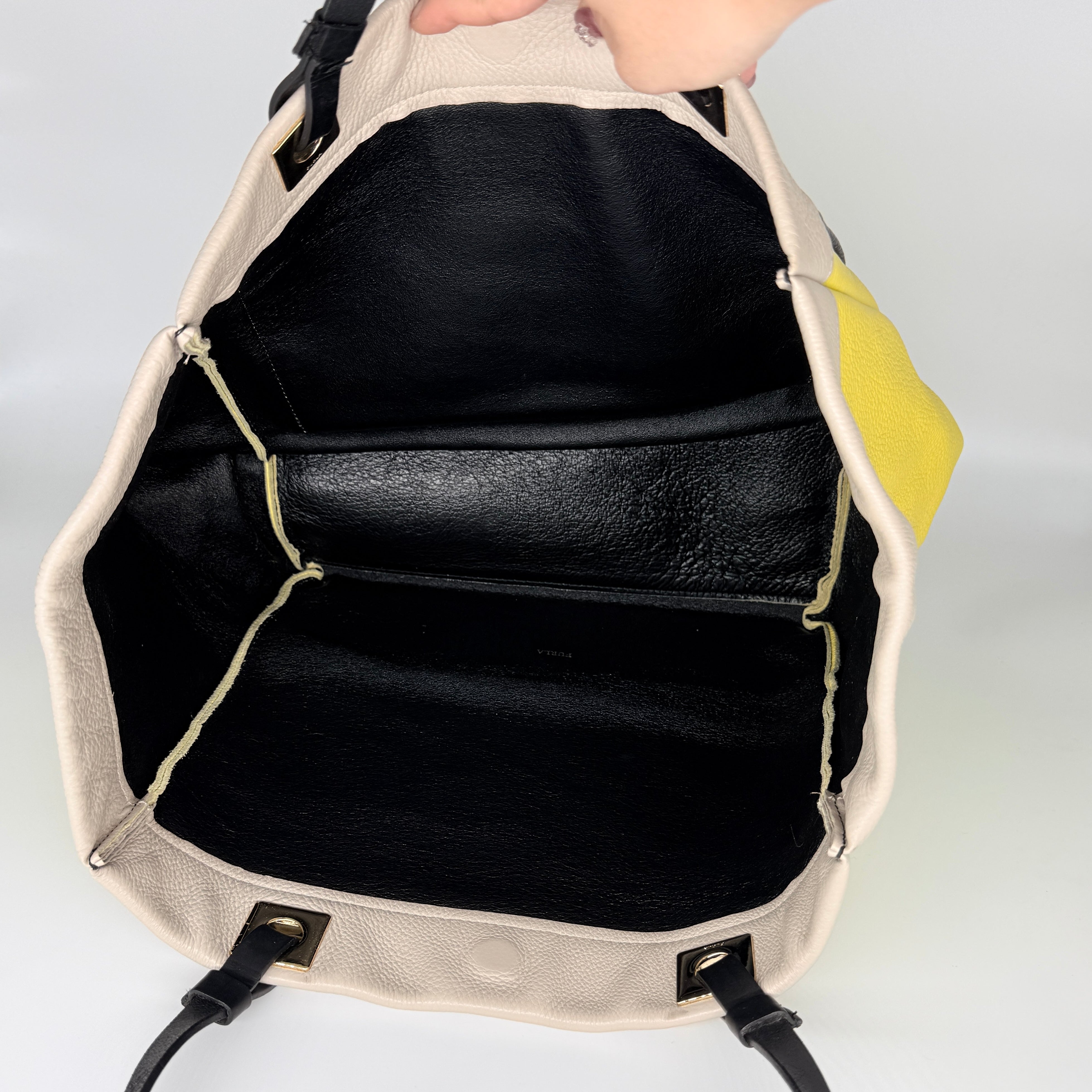Furla Shopper Tote in neon yellow and beige grained leather with black handles and gold-tone hardware.