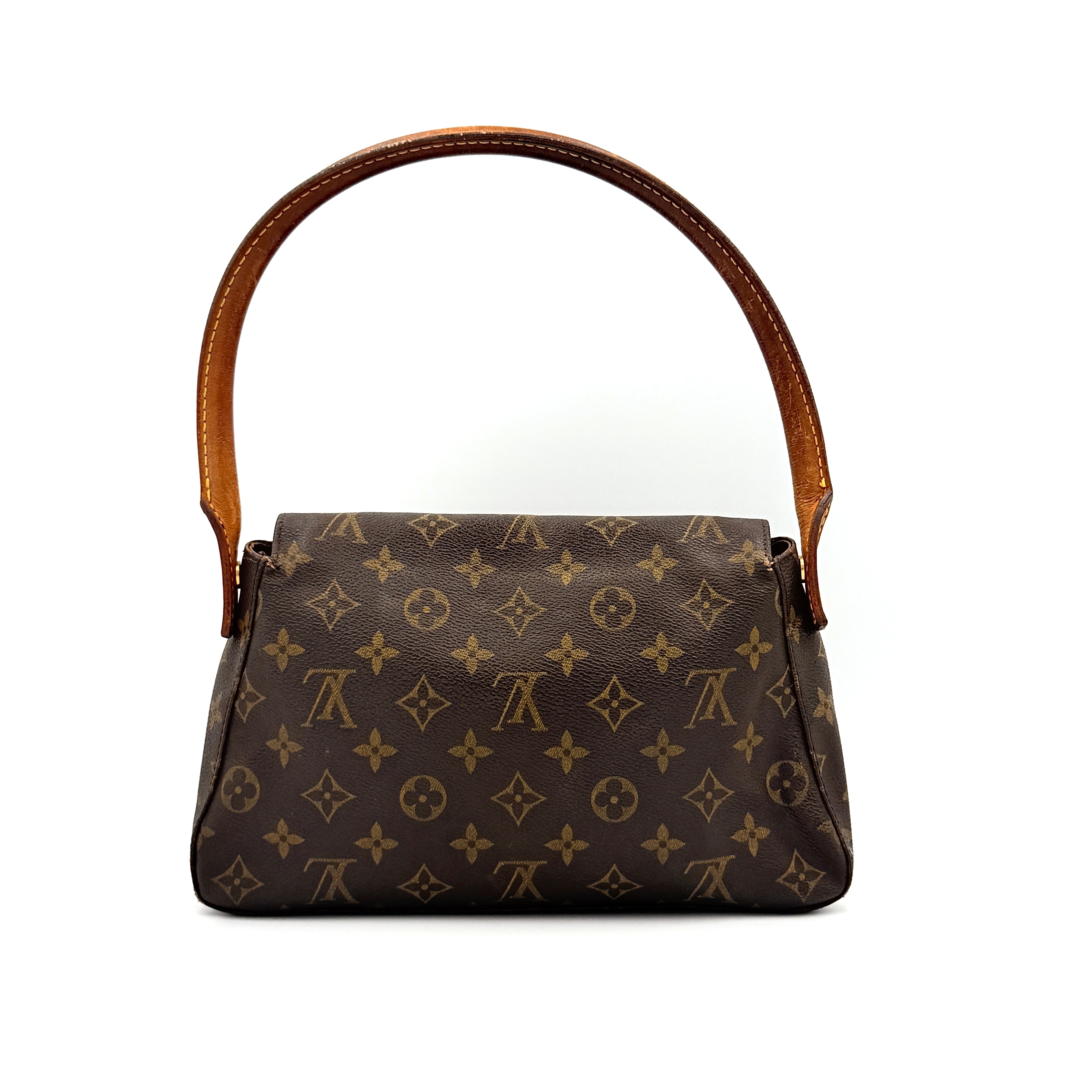 Louis Vuitton Monogram Mini Looping Shoulder Bag in brown monogram canvas with curved vachetta leather shoulder strap displayed upright.