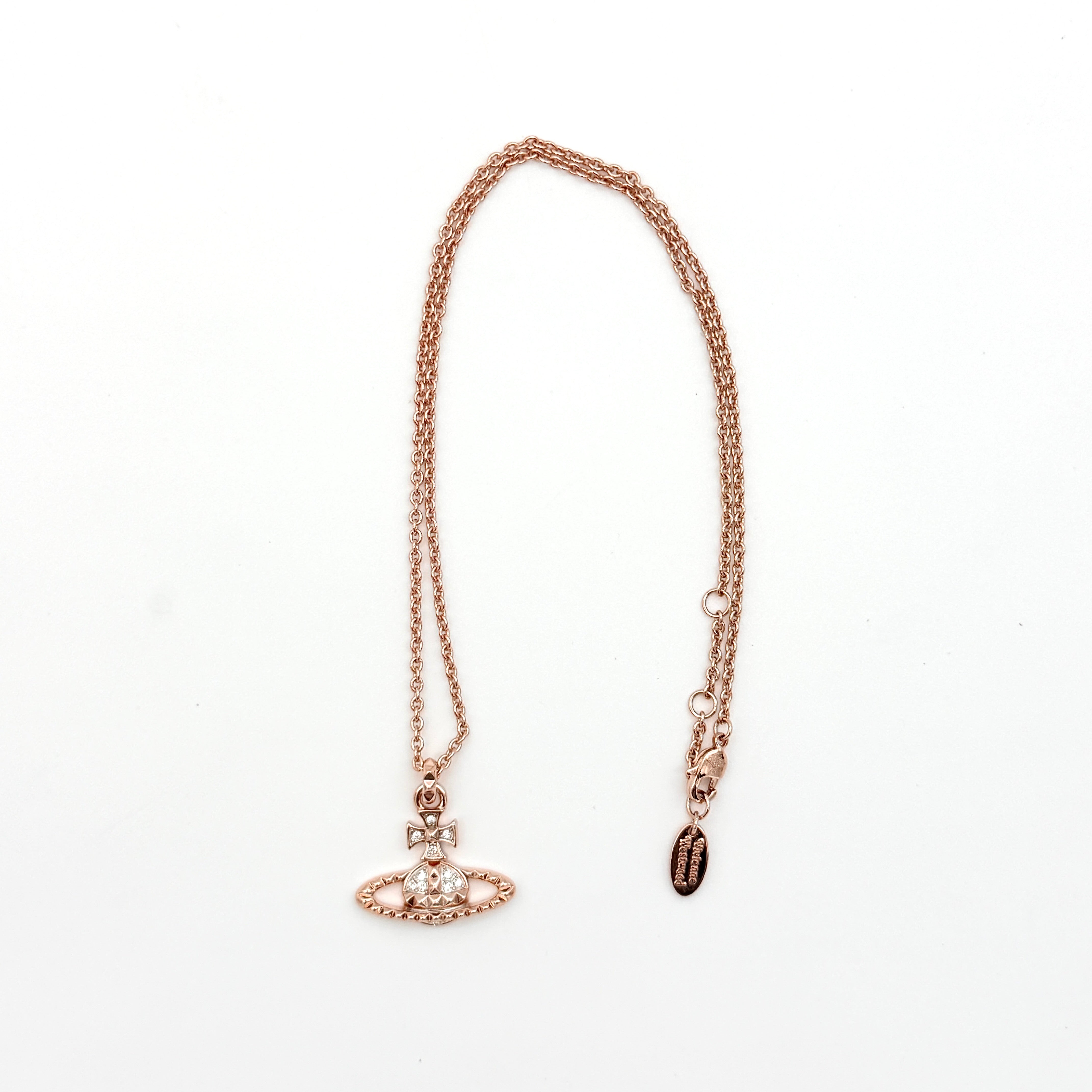 Vivienne Westwood rose gold Orb necklace with rhinestone accents displayed on a white background.