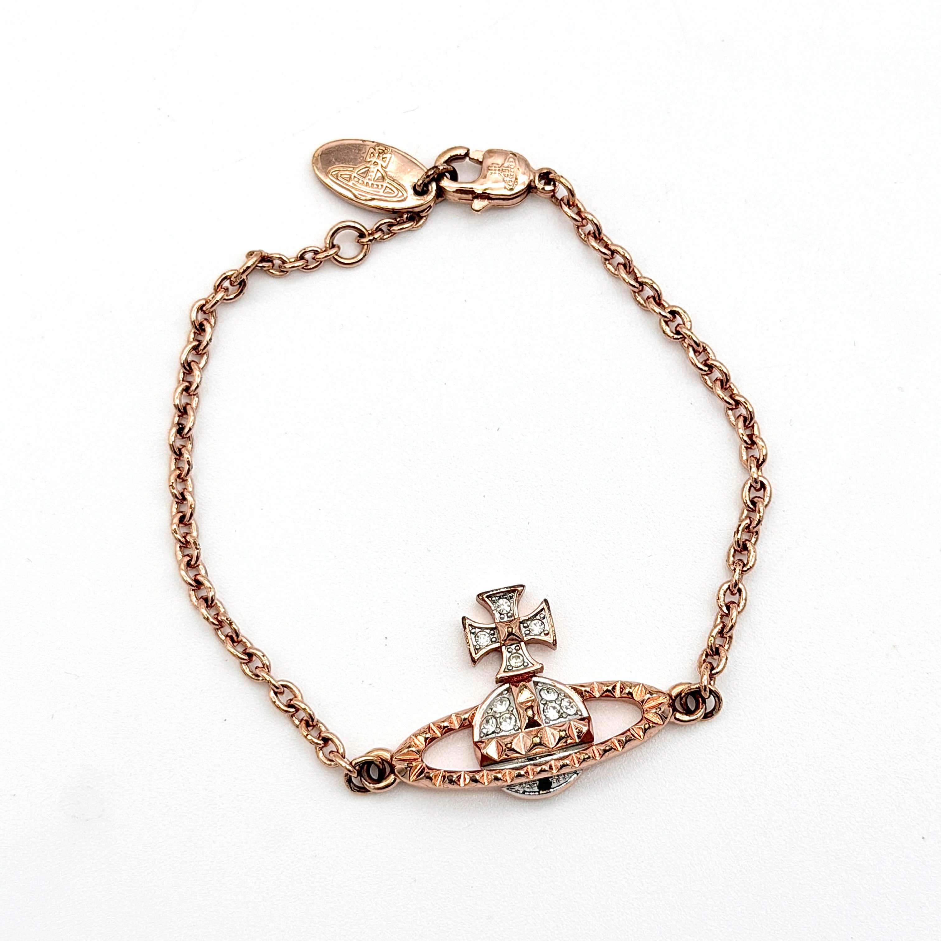 Vivienne Westwood 3D Orb rhinestone bracelet in rose gold with crystal accents and a fine chain.