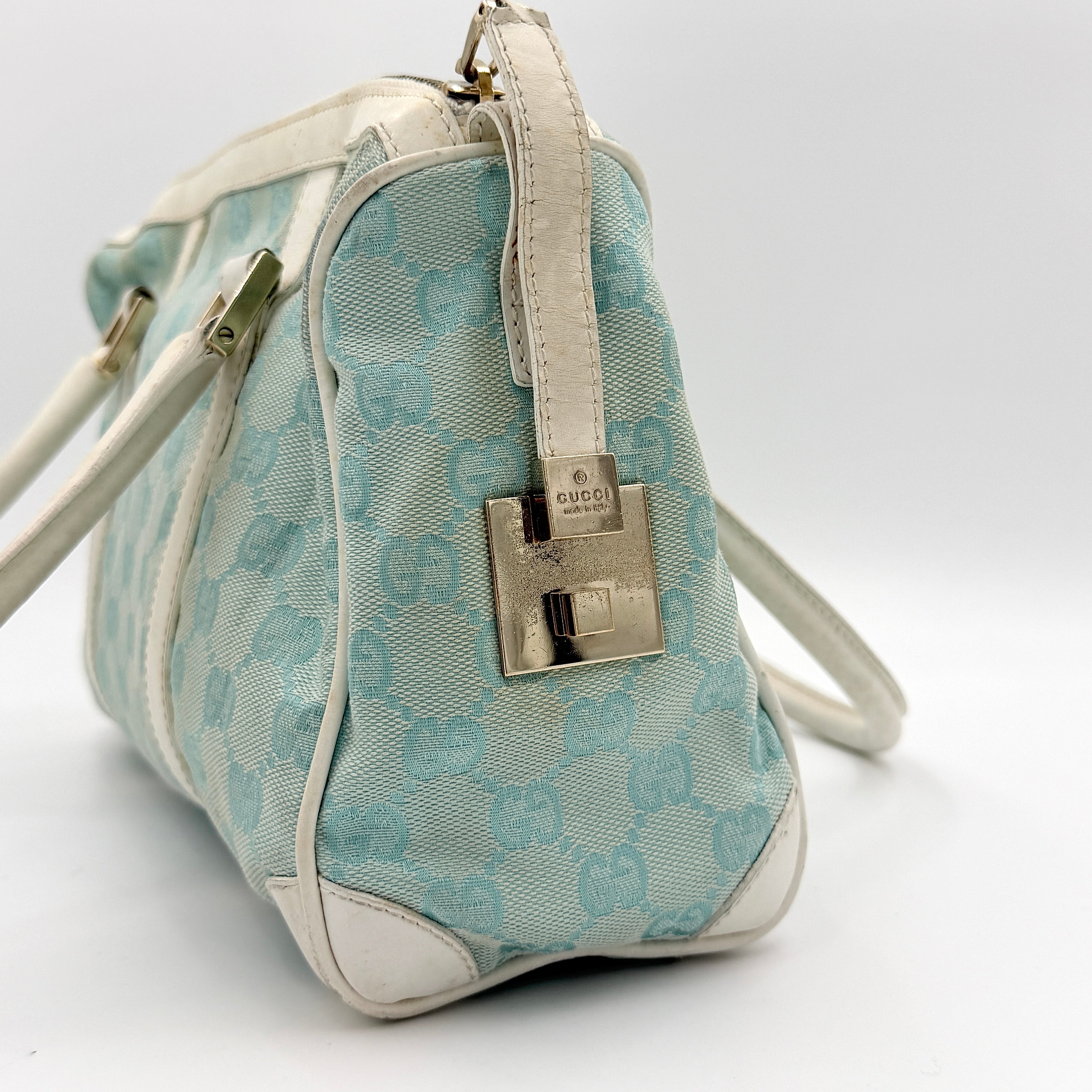 Gucci GG Monogram Boston Shoulder Bag in blue and white canvas with white leather trim, structured silhouette and double top handles.
