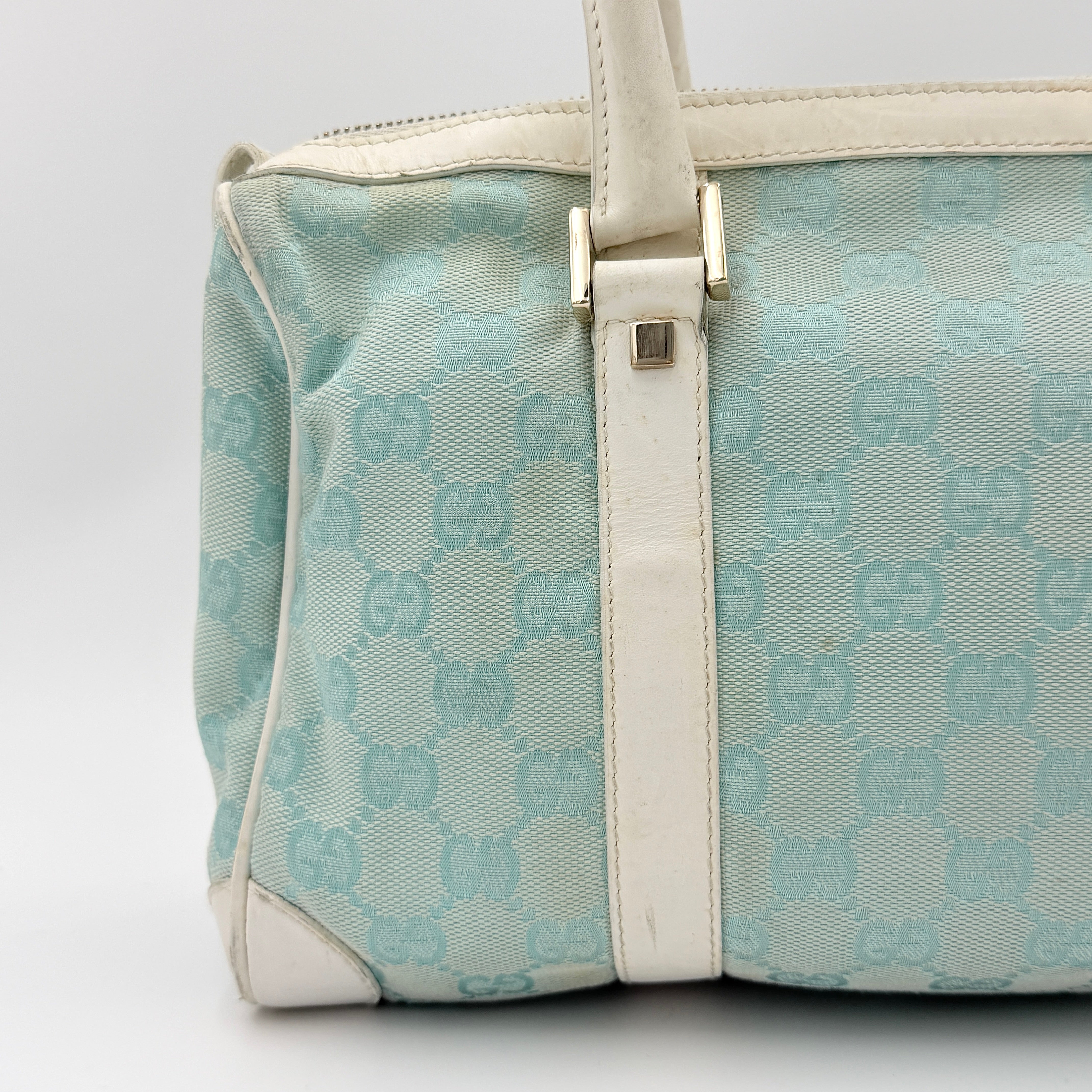 Gucci GG Monogram Boston Shoulder Bag in blue and white canvas with white leather trim, structured silhouette and double top handles.