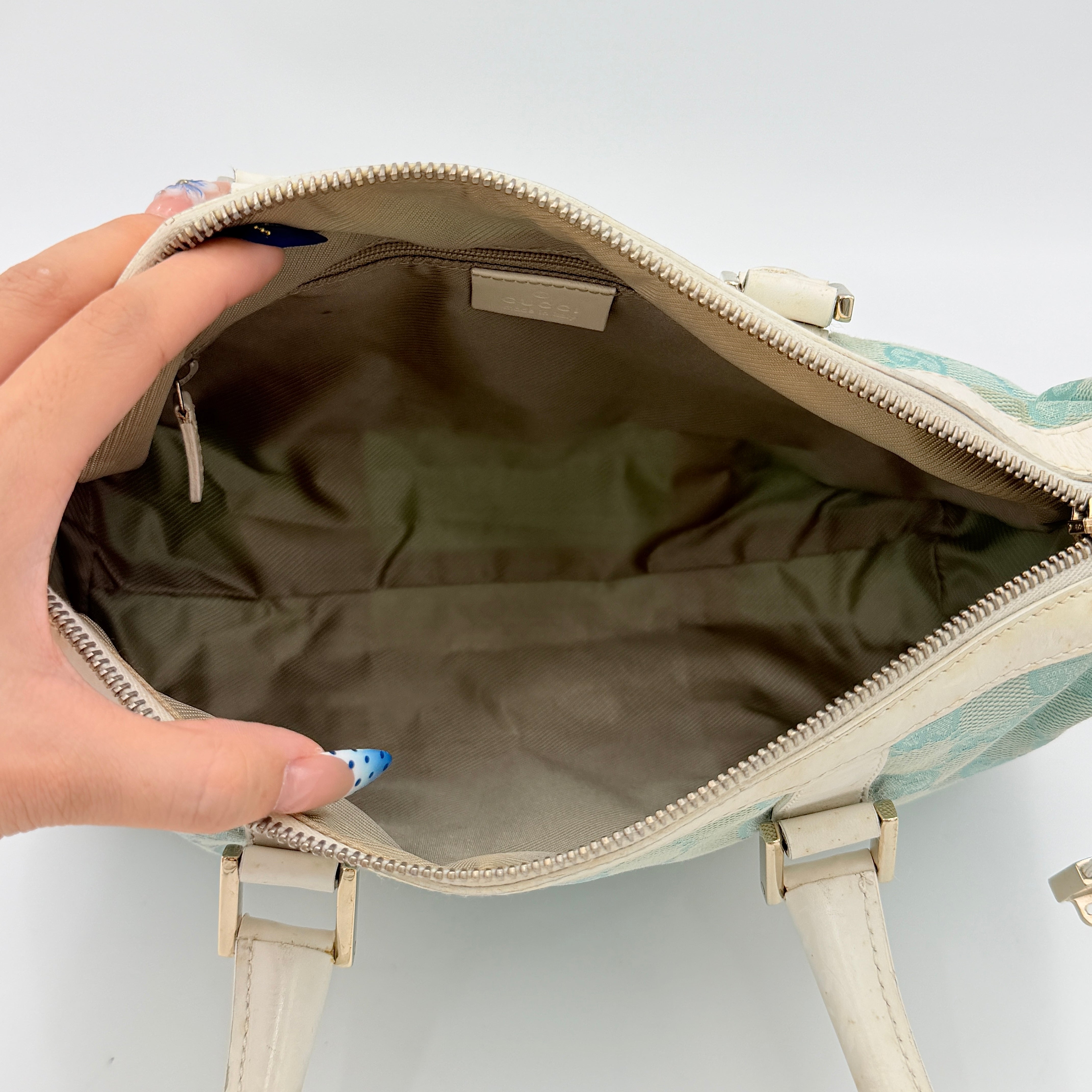 Gucci GG Monogram Boston Shoulder Bag in blue and white canvas with white leather trim, structured silhouette and double top handles.
