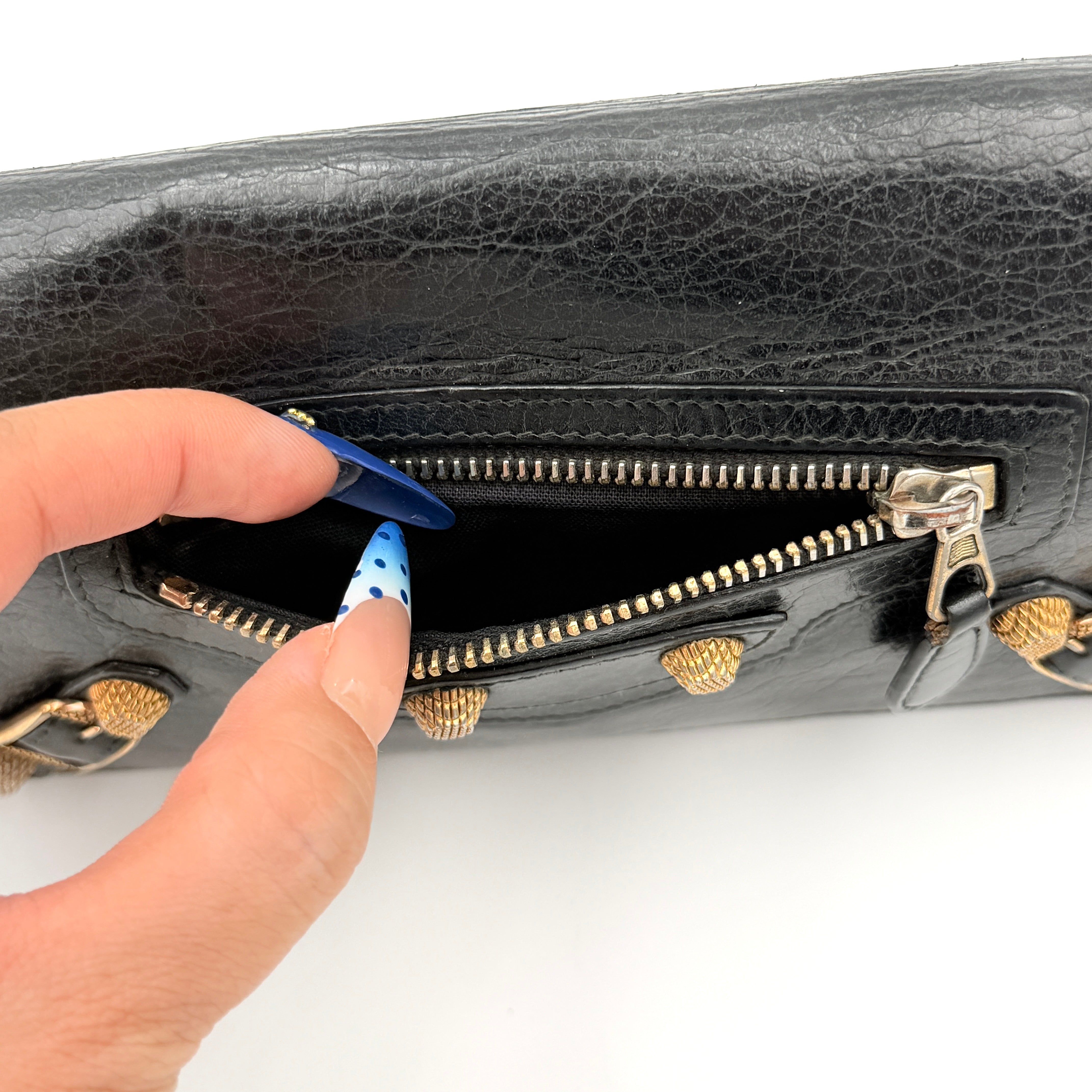 Balenciaga Motorcycle Studded Long Wallet in black distressed leather with signature brass studs and buckle details.