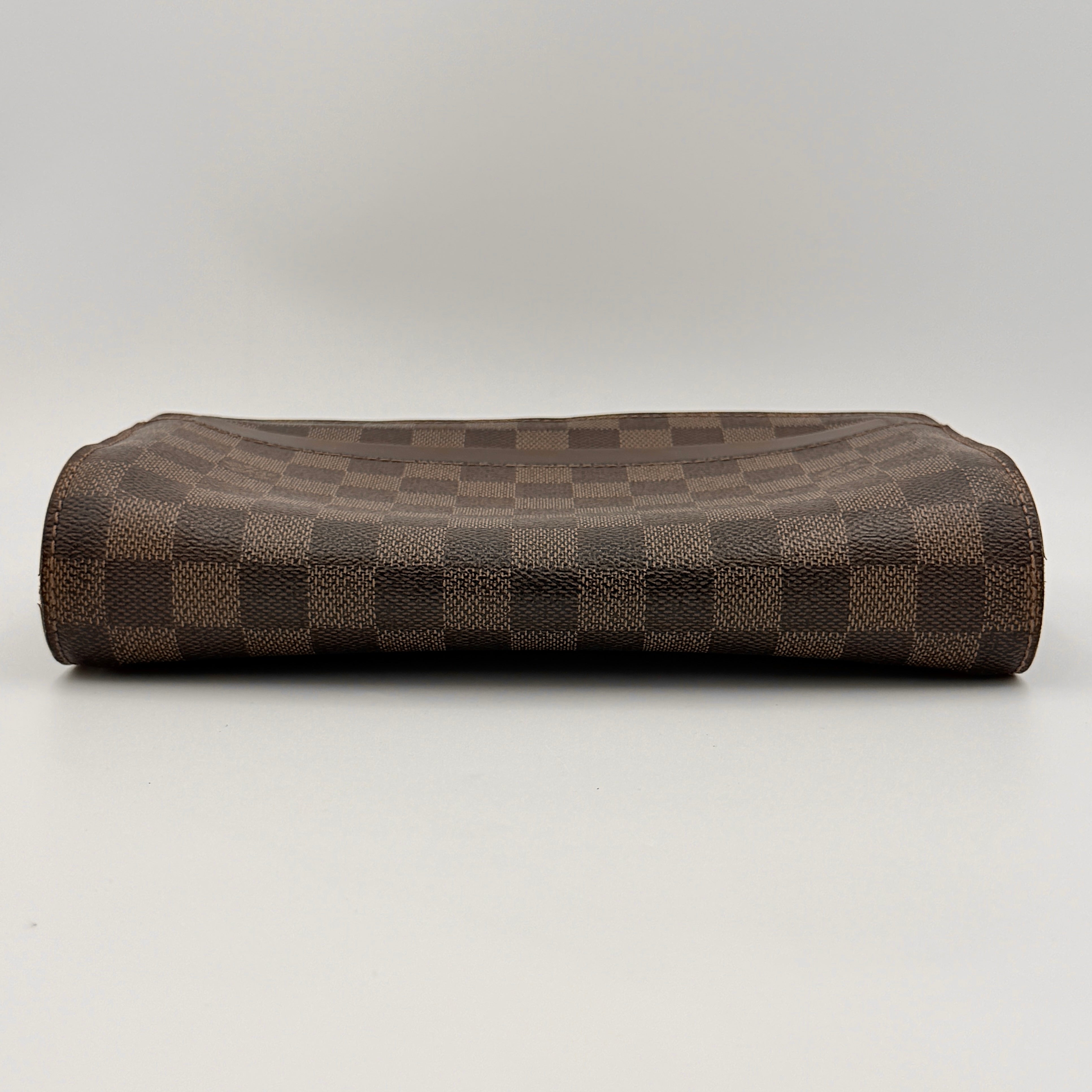 Louis Vuitton Saint Louis Damier Clutch Bag in brown Damier Ebene canvas with chocolate leather trim and gold-tone hardware, photographed on white background.