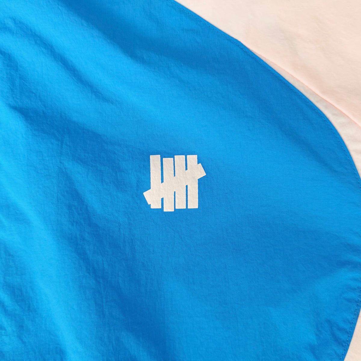 (L) Undefeated Lightweight Hooded Windbreaker Jacket Blue/Pink