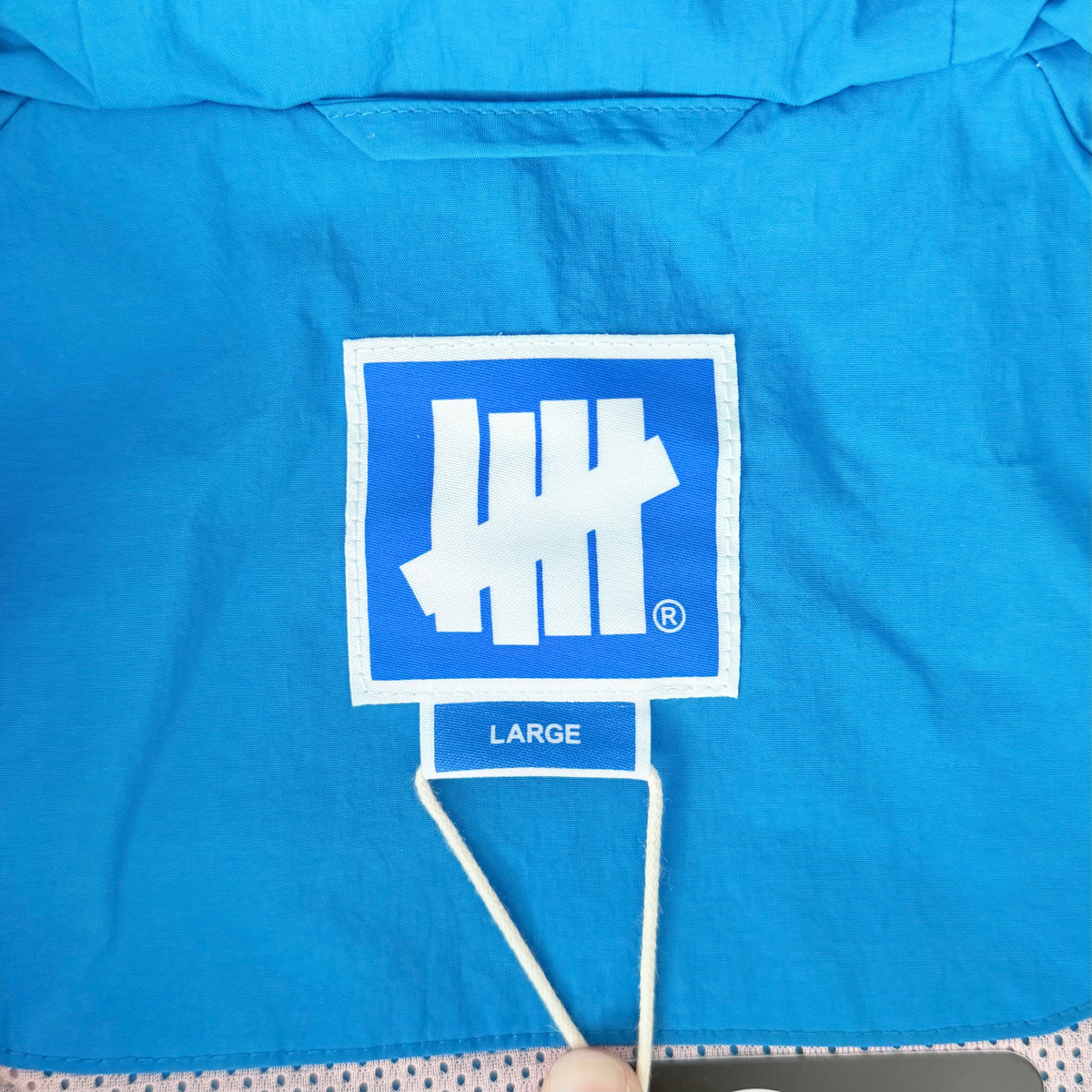 (L) Undefeated Lightweight Hooded Windbreaker Jacket Blue/Pink