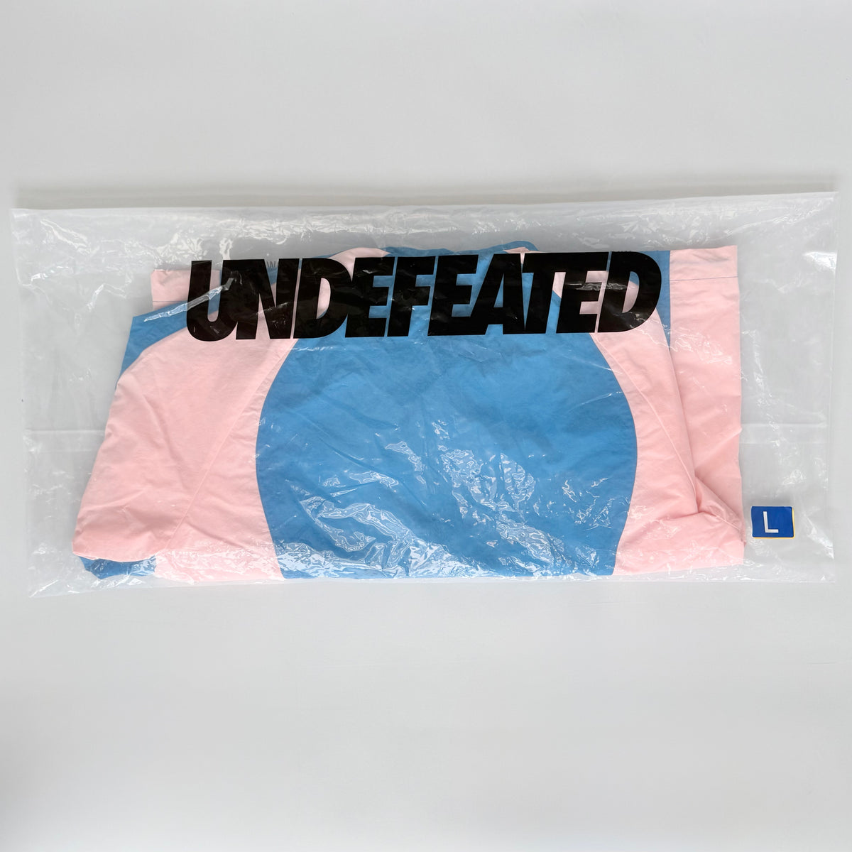 (L) Undefeated Lightweight Hooded Windbreaker Jacket Blue/Pink