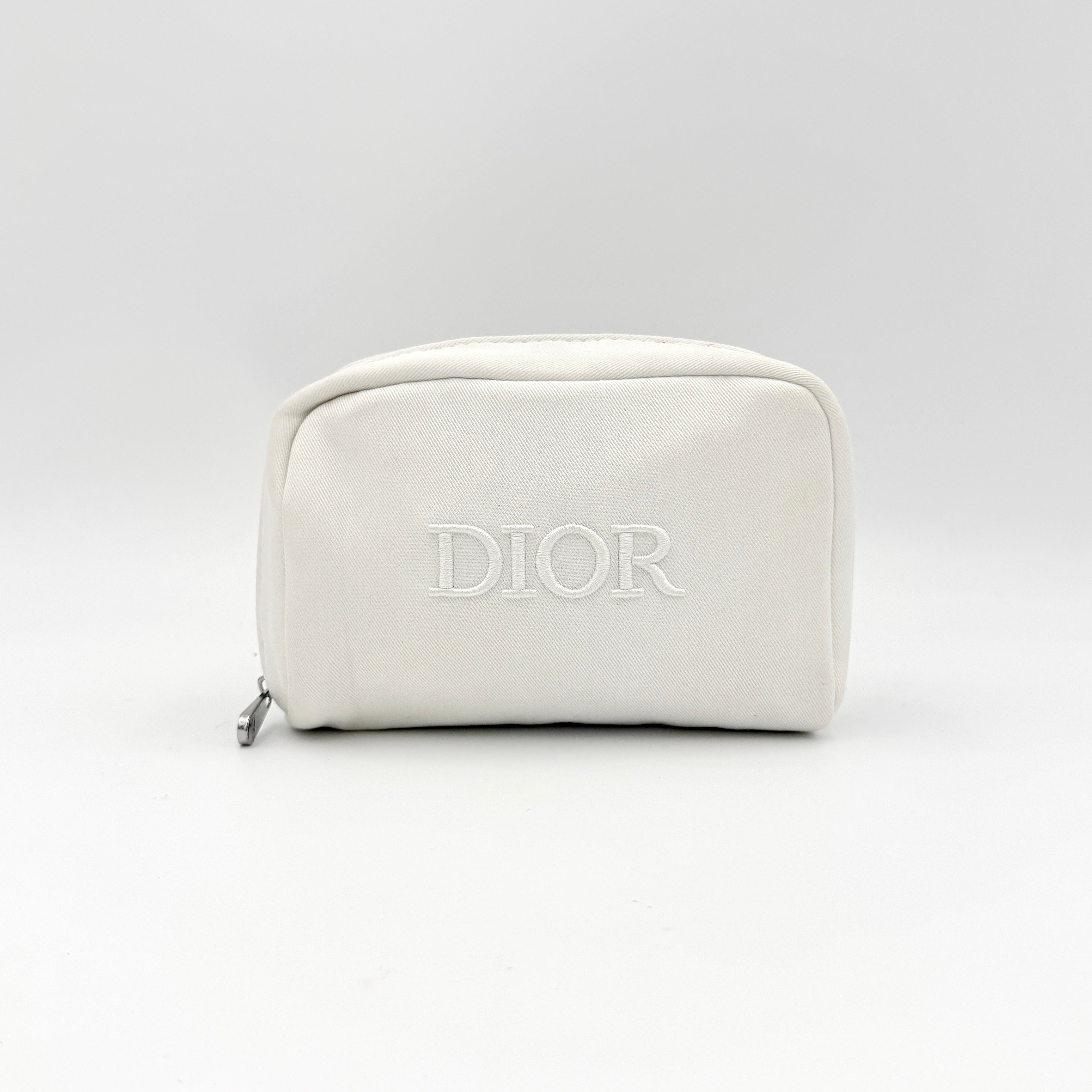 Crisp white Dior Beauty Logo Pouch with an embroidered logo and sleek silver-tone zipper, showcased against a minimalist backdrop.