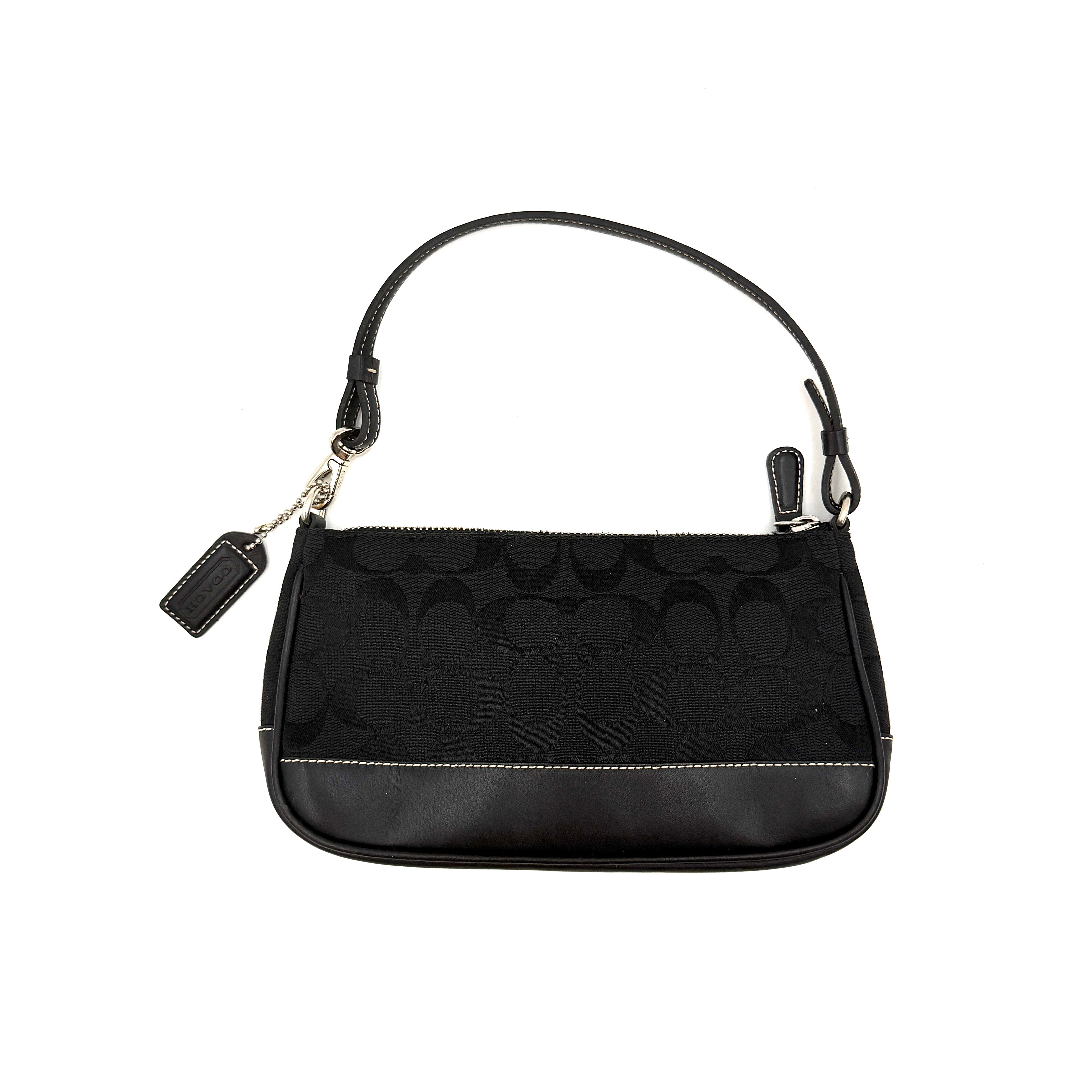 Coach Y2K Demi Shoulder Bag in black signature jacquard with leather trim, white topstitching, and silver hardware, shown with its classic tag.