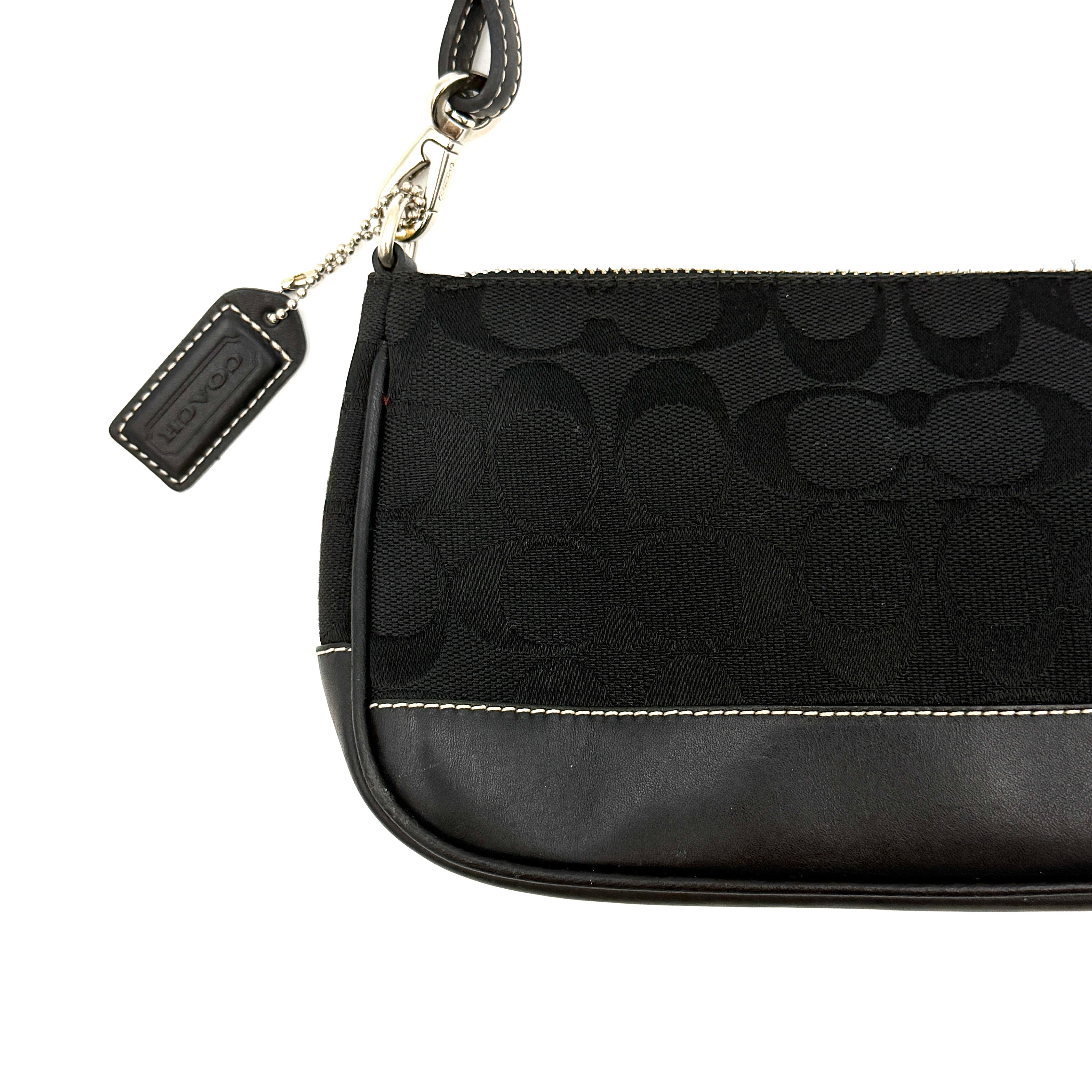 Coach Y2K Demi Shoulder Bag in black signature jacquard with leather trim, white topstitching, and silver hardware, shown with its classic tag.