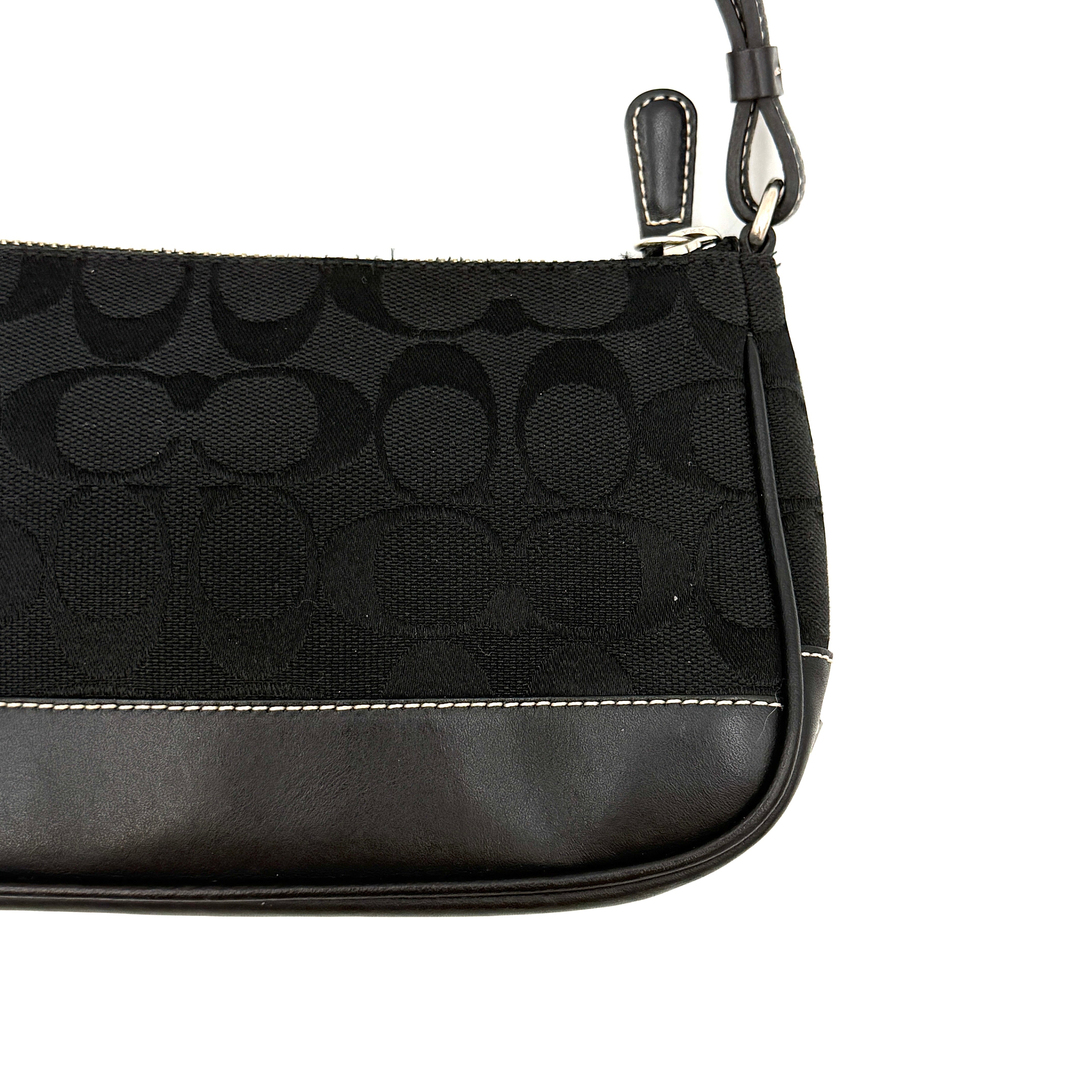 Coach Y2K Demi Shoulder Bag in black signature jacquard with leather trim, white topstitching, and silver hardware, shown with its classic tag.