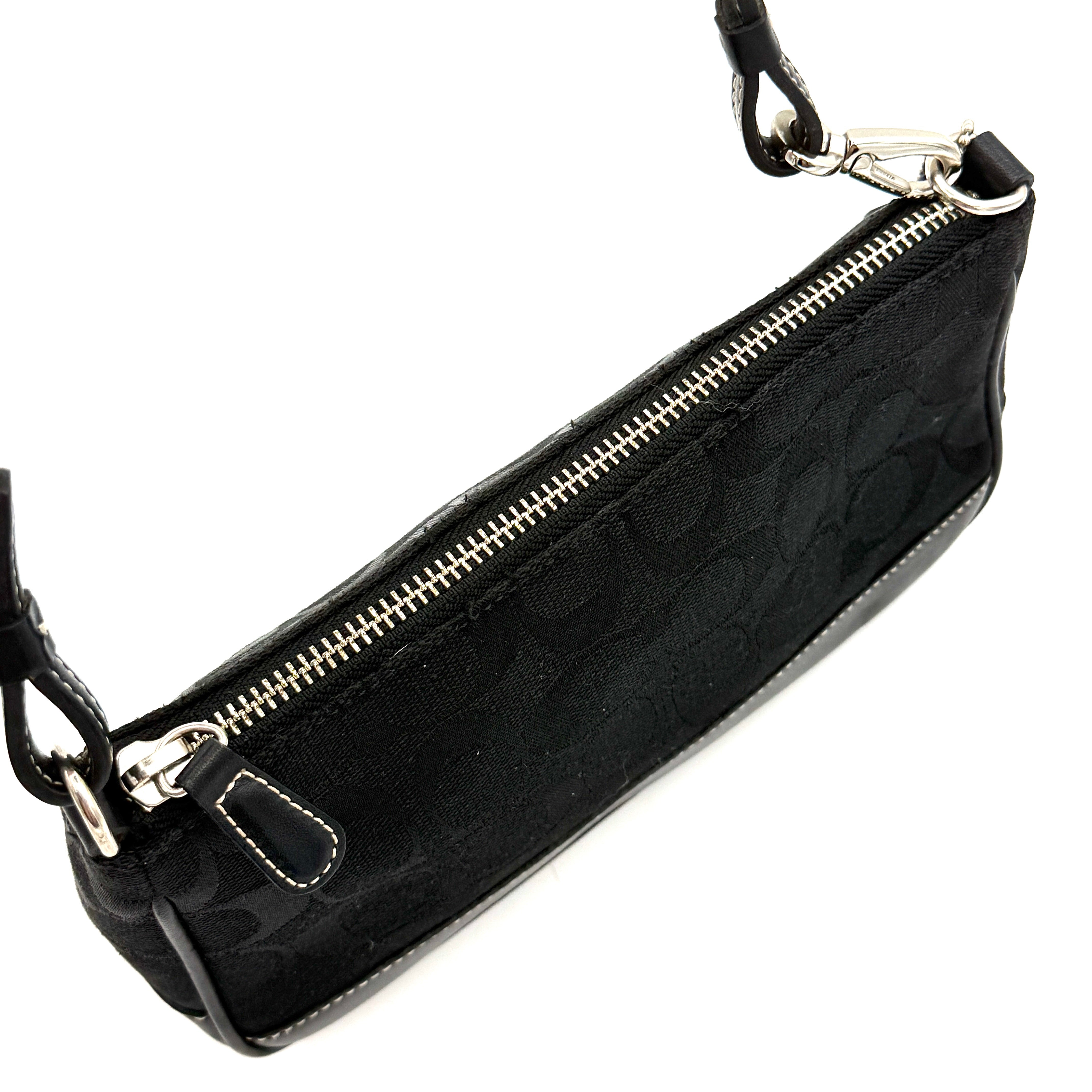 Coach Y2K Demi Shoulder Bag in black signature jacquard with leather trim, white topstitching, and silver hardware, shown with its classic tag.