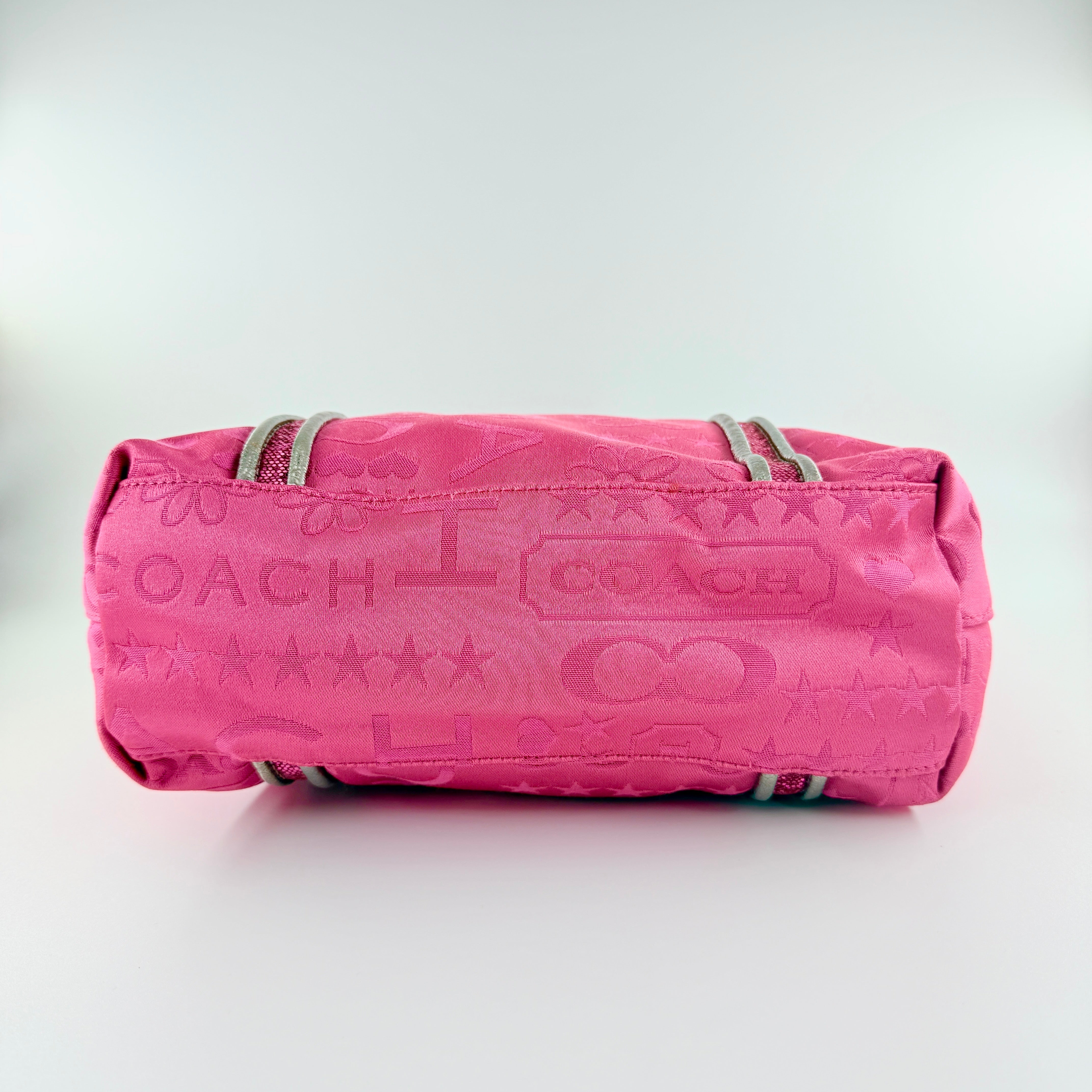 Coach Poppy Bandana Glitter Graffiti Tote Bag in vibrant pink with metallic silver handles, adorned with glitter accents and butterfly charm.
