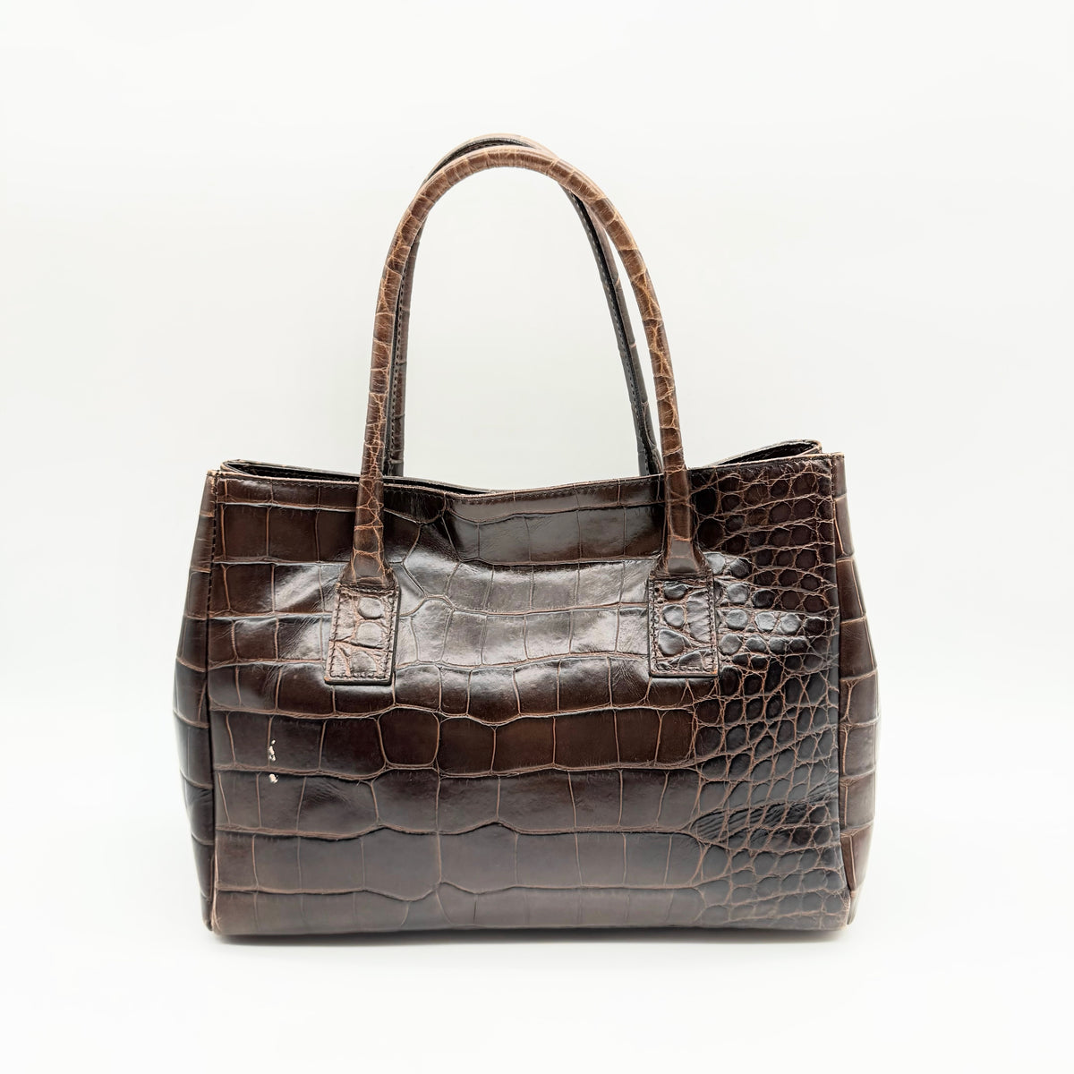 Furla dark brown croc-embossed leather handbag with silver-tone hardware and double top handles, photographed against a clean white background.