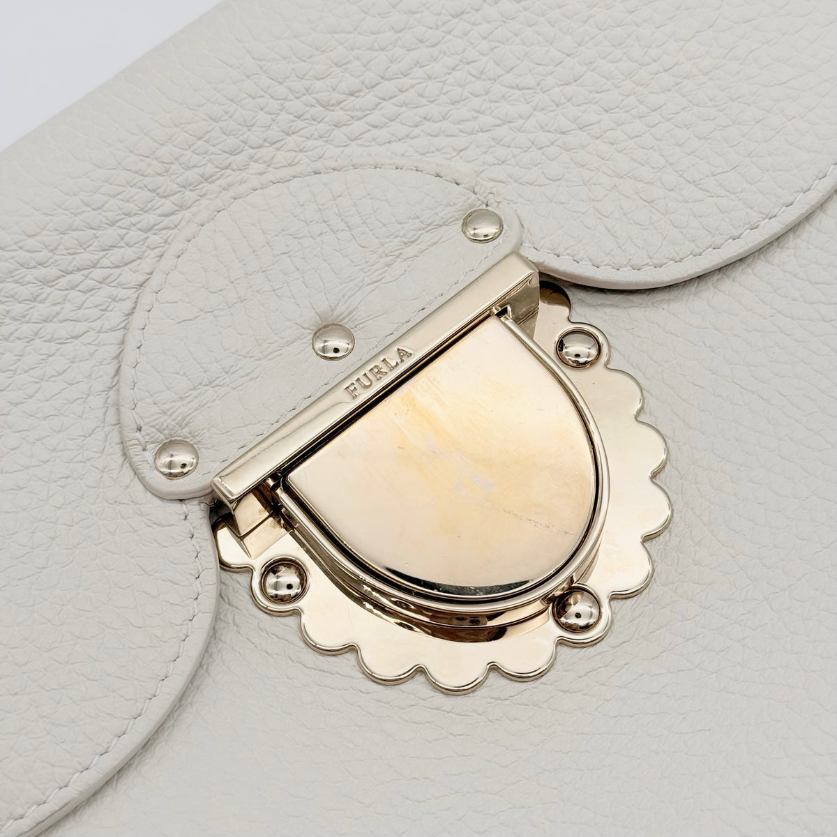 Furla 2Way Ducale Mini Handbag in creamy white leather with gold hardware, top handle, and detachable strap displayed flat with authenticity card.